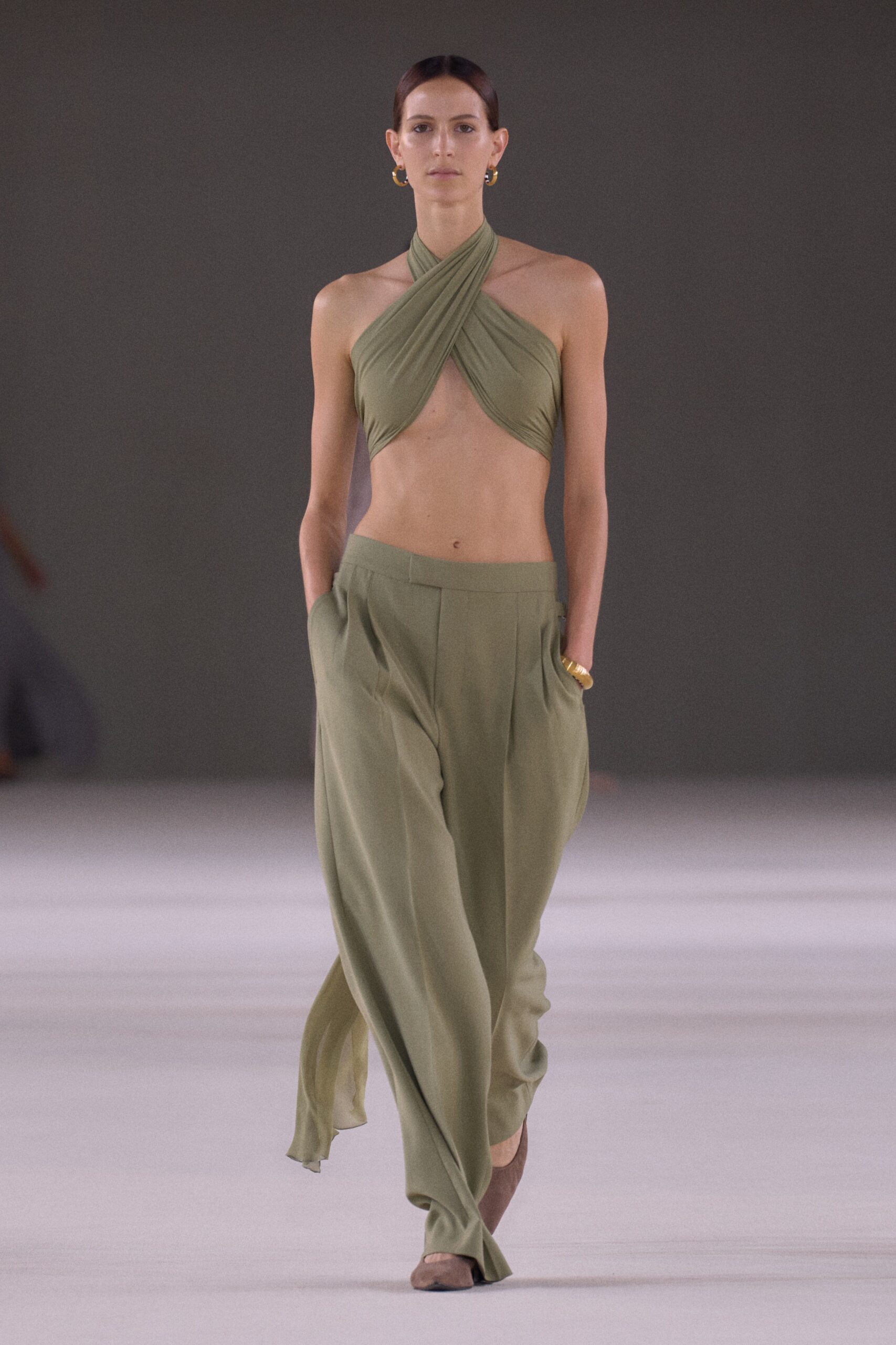 green silk halter top and relaxed pants