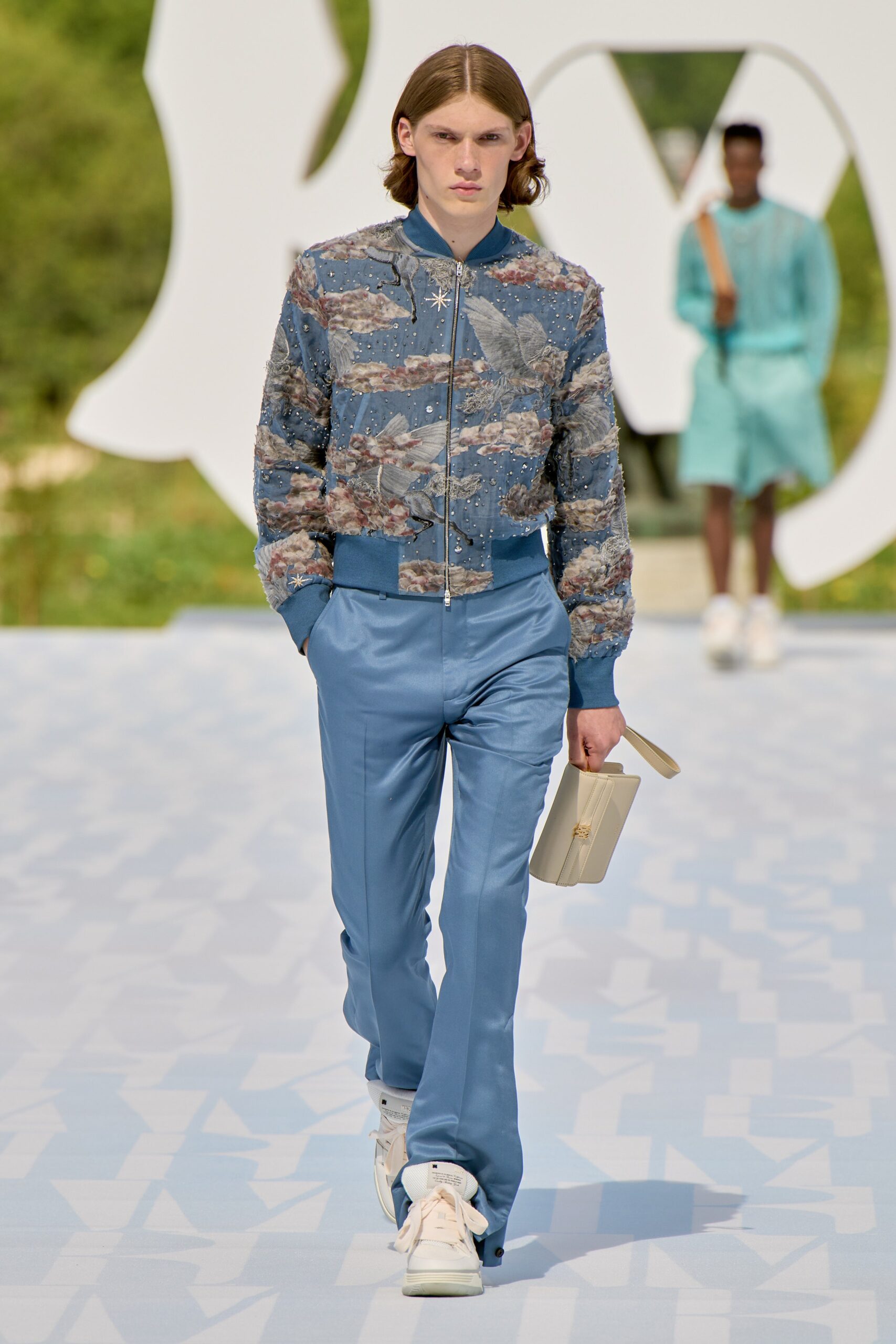 blue silk jacket and tailored pants