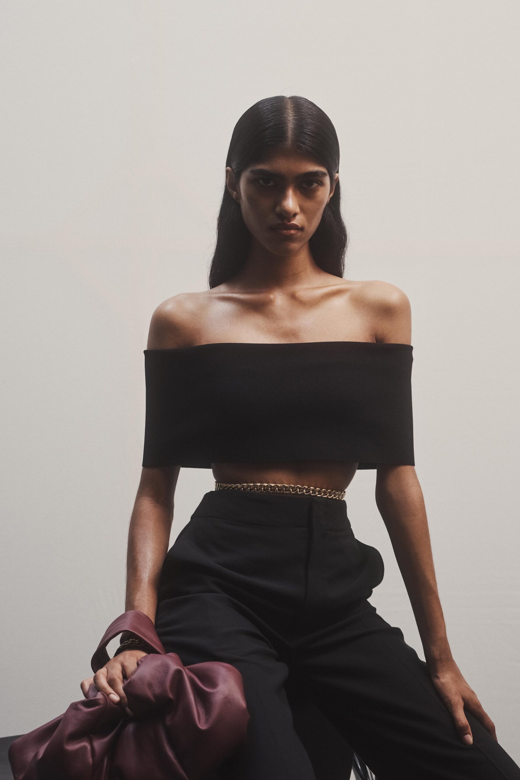 black off-shoulder top and fitted pants