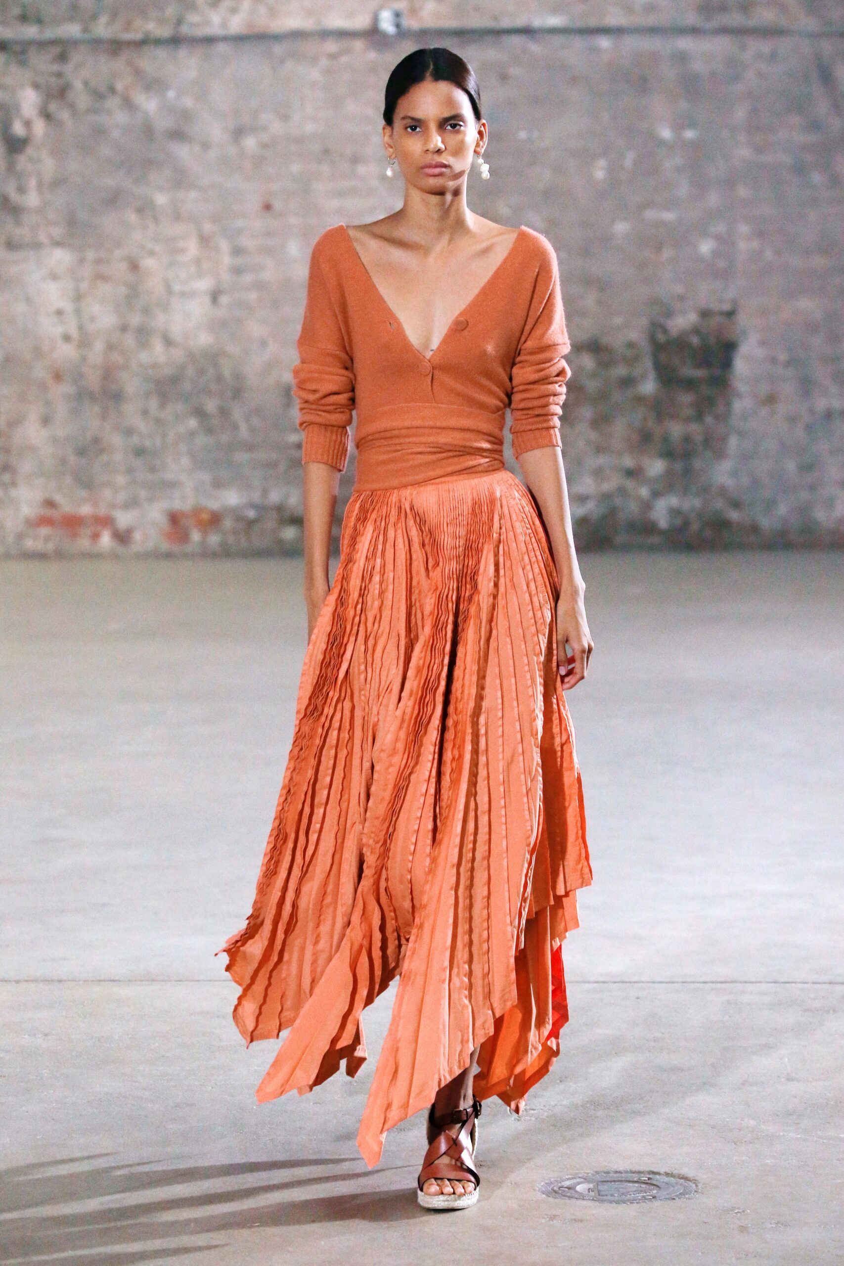orange pleated skirt and top