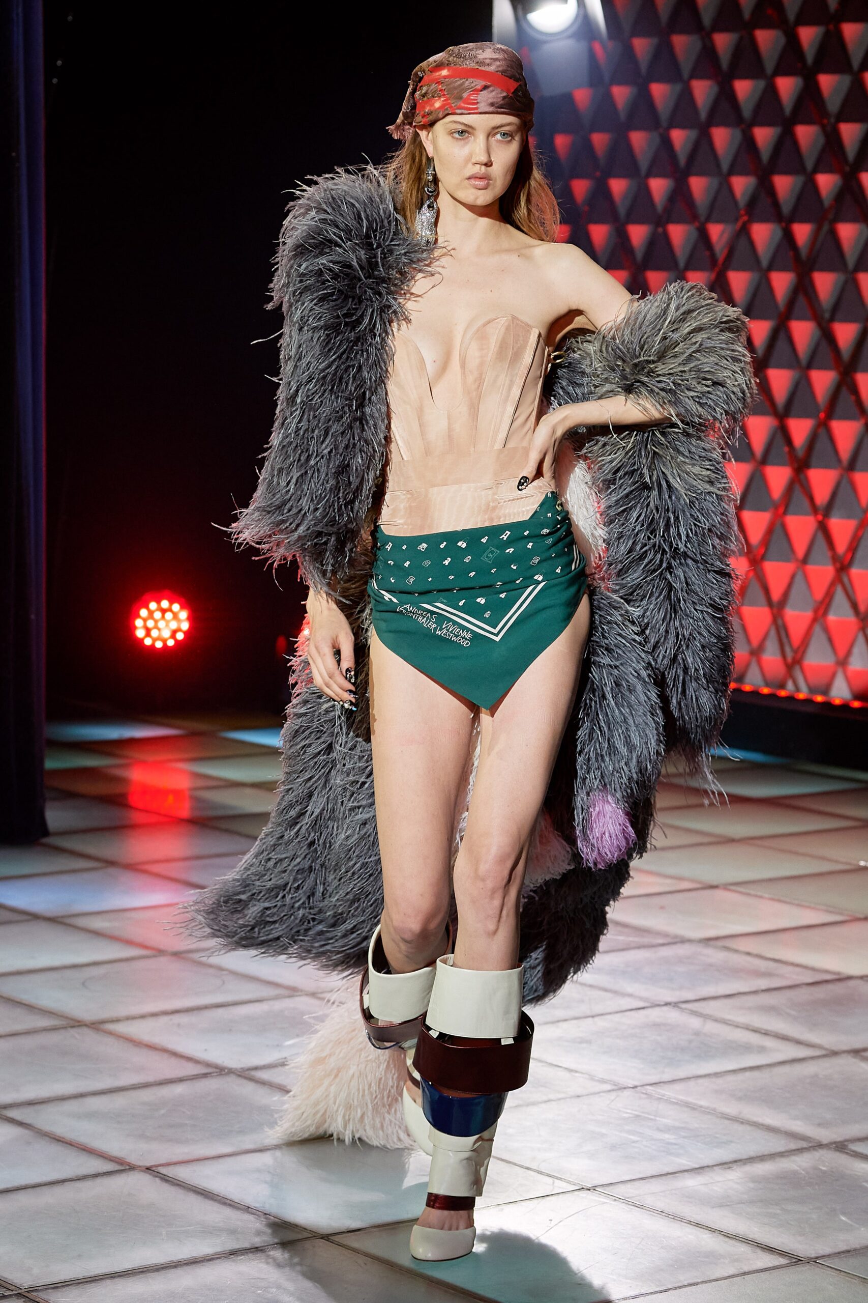 beige silk strapless gown with gray fur coat