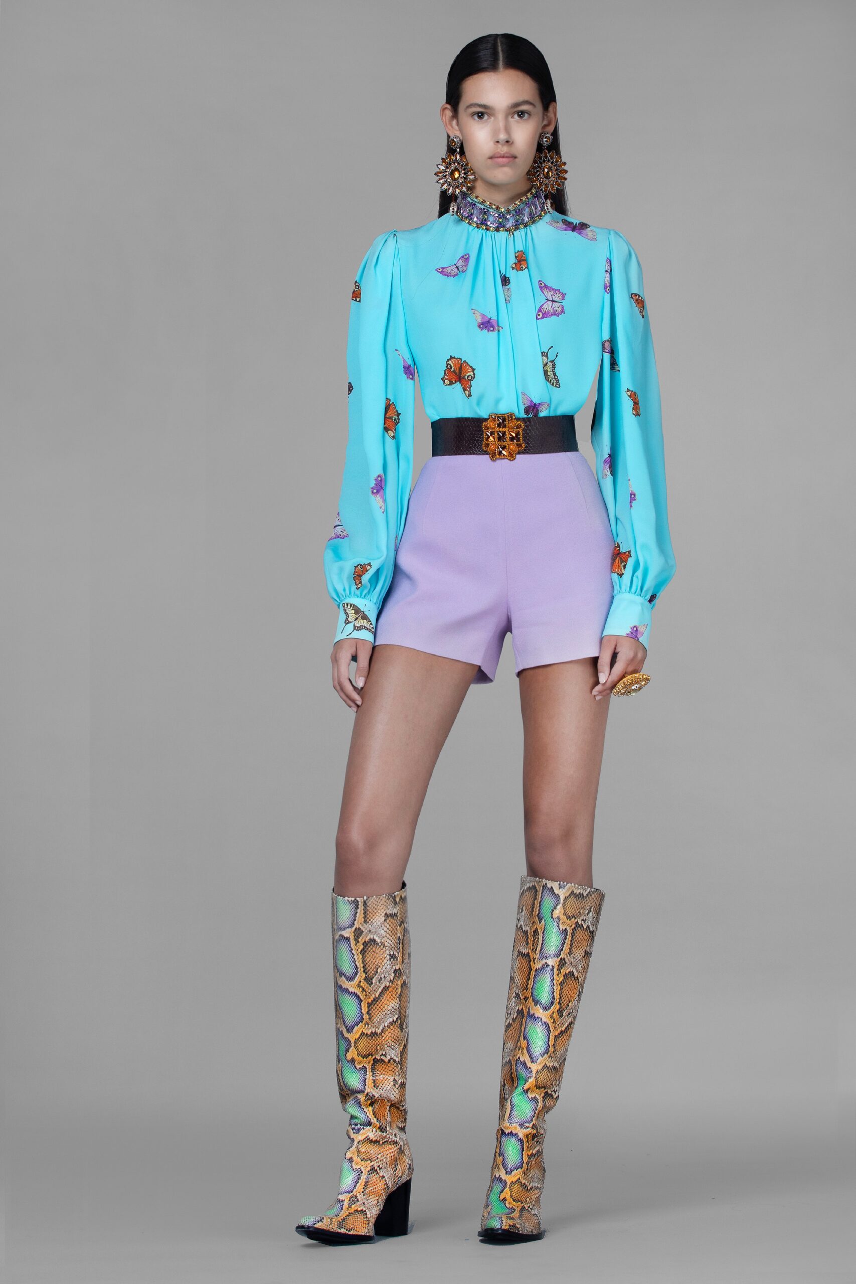 blue silk blouse with purple shorts