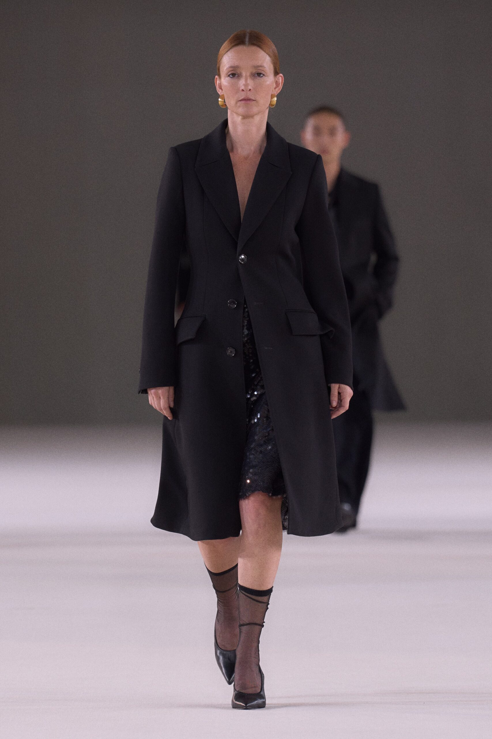 black wool coat and sequined dress