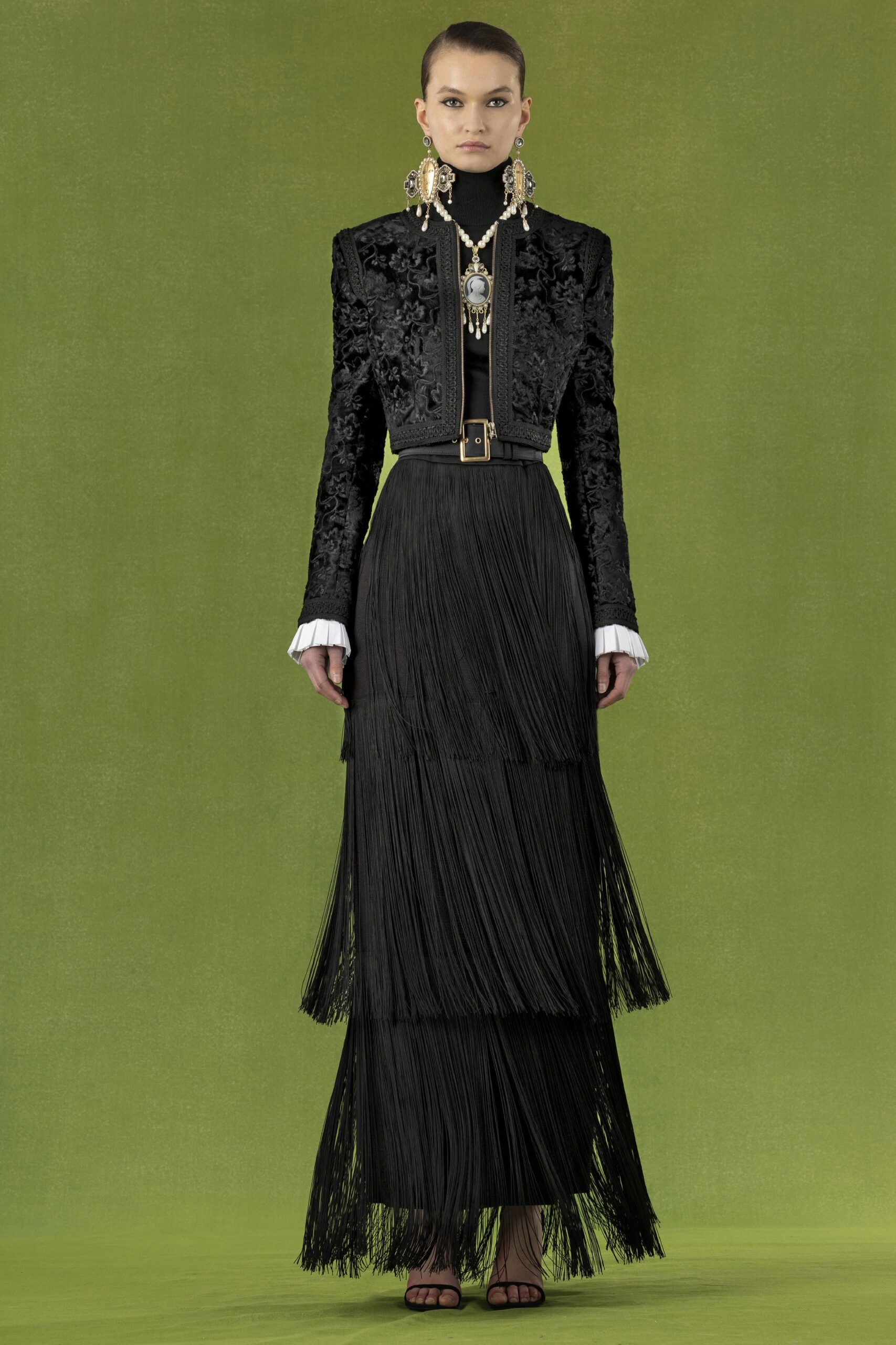 black embroidered jacket and fringed skirt