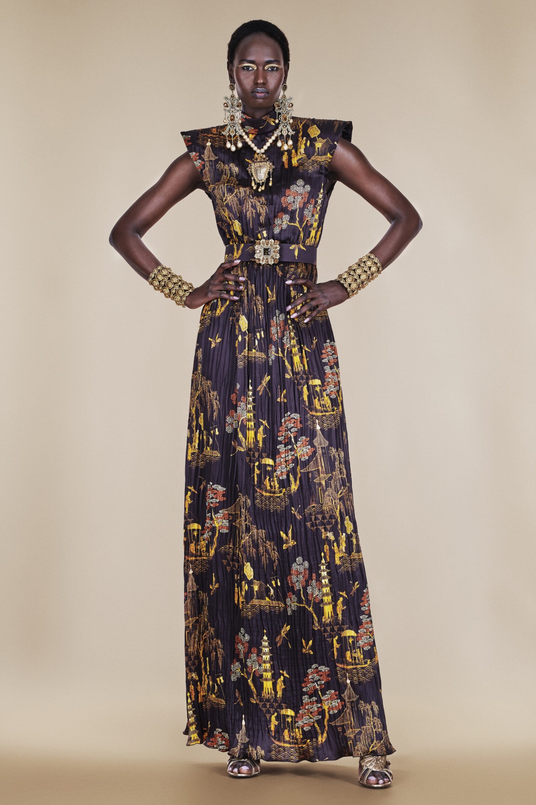 black and gold pleated gown