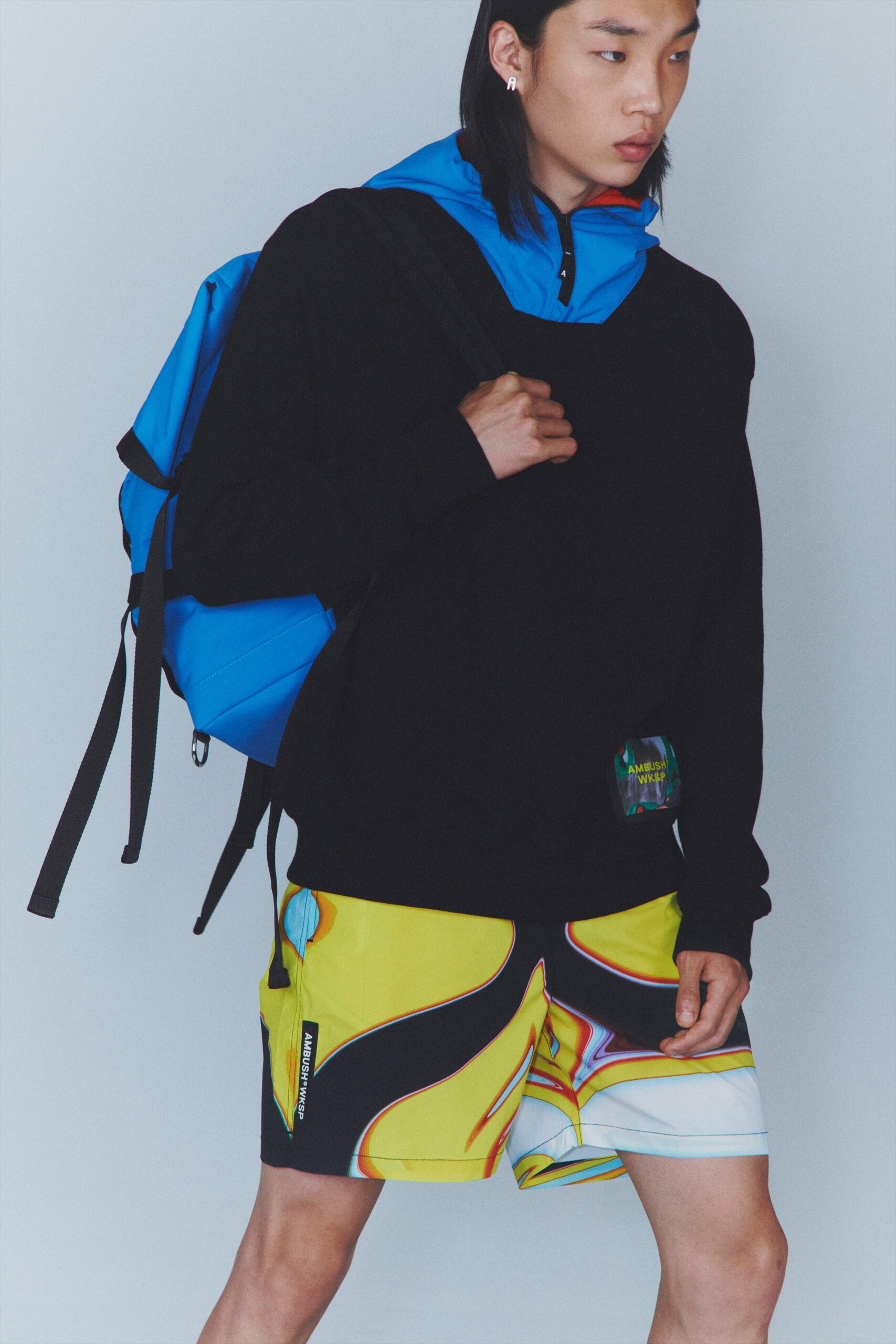 black hoodie and yellow shorts