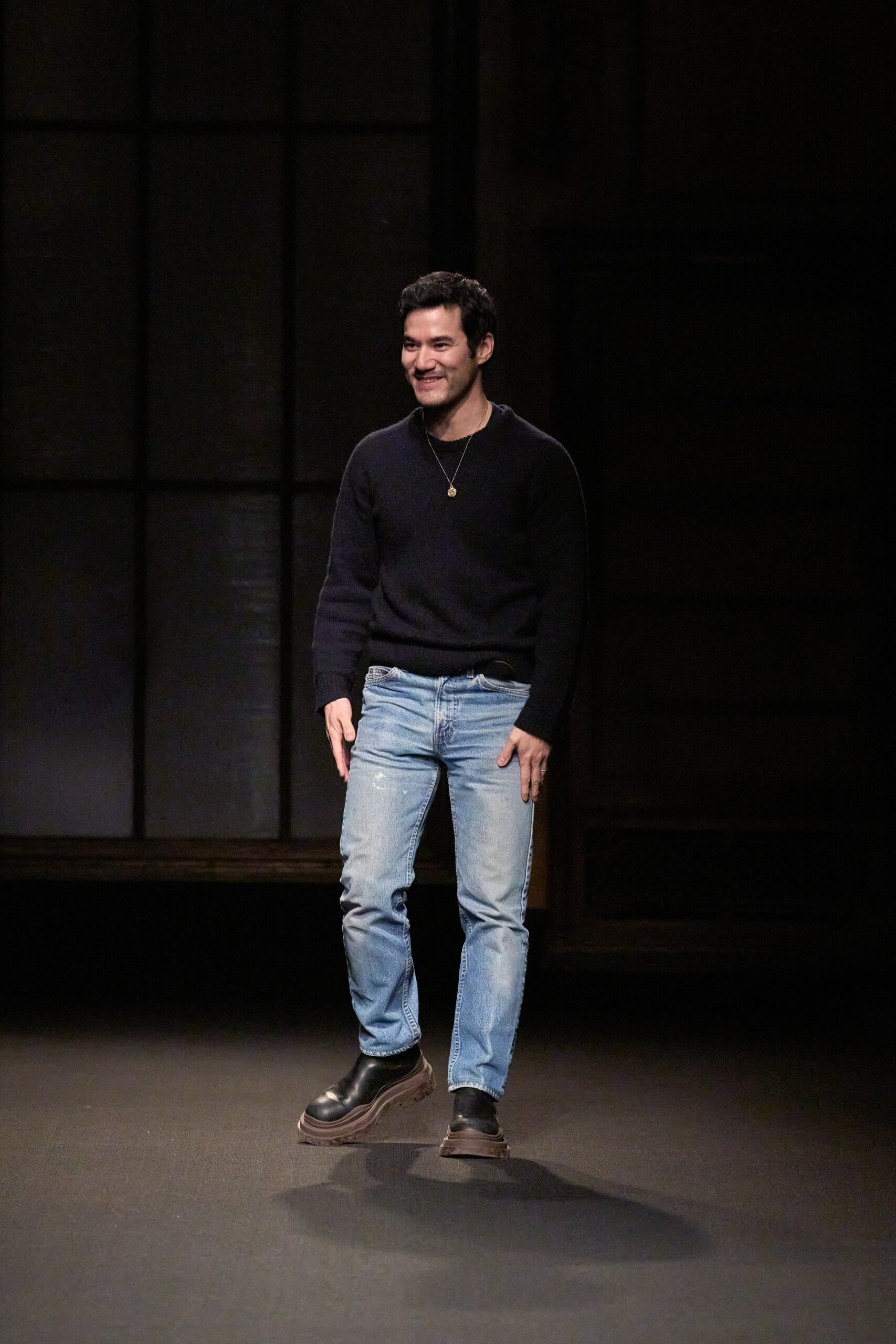 black wool sweater with blue jeans