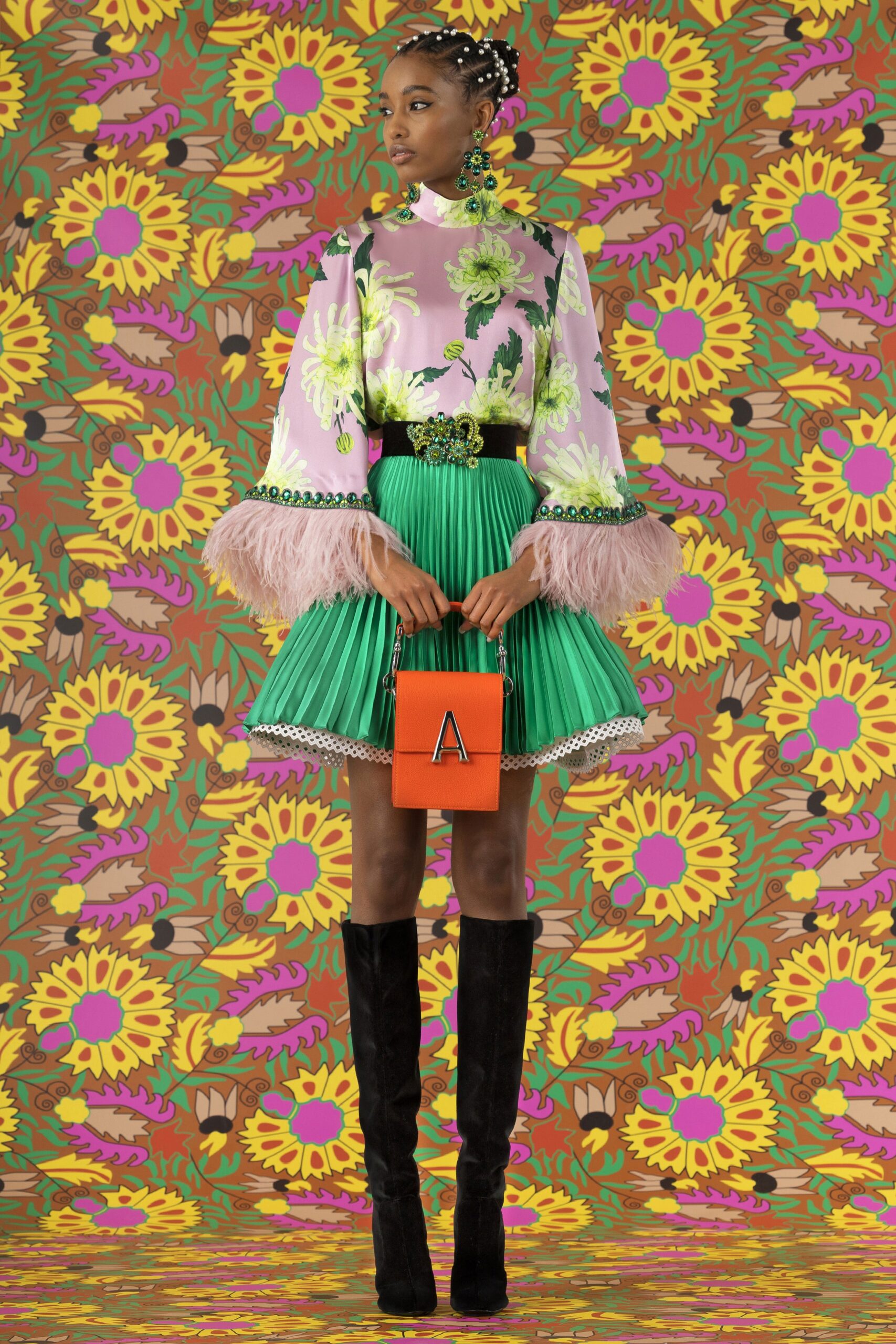 pink floral blouse with green pleated skirt