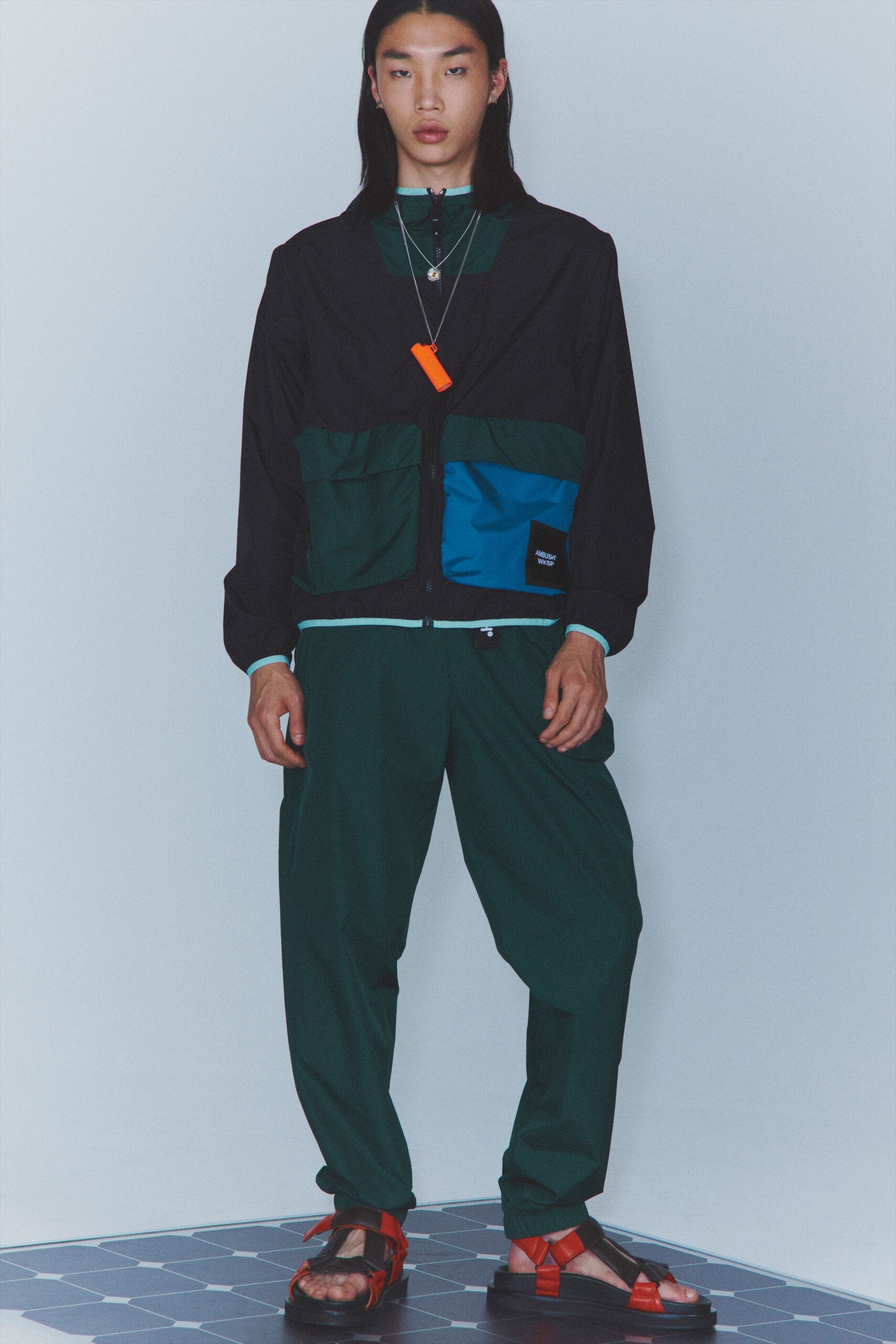 black and blue relaxed jacket with green pants