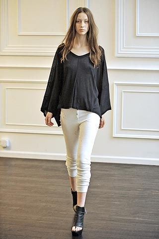 black relaxed top with white pants