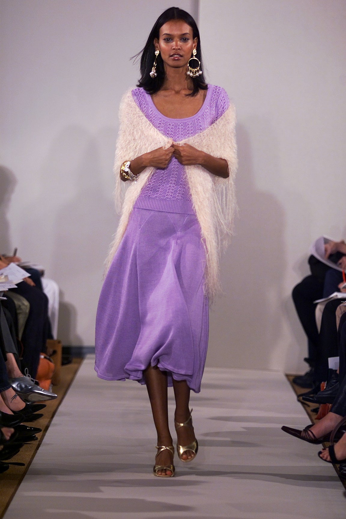 purple top and skirt with white cardigan