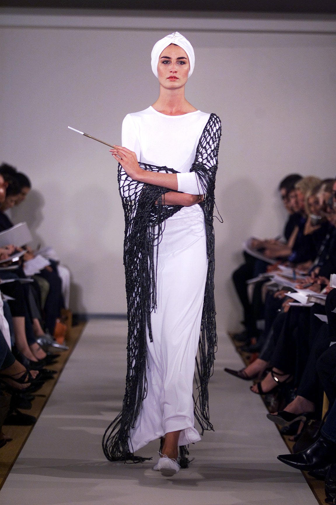 white fitted gown with black cape