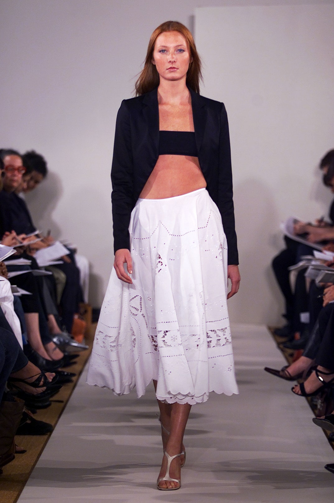 black fitted jacket white pleated skirt