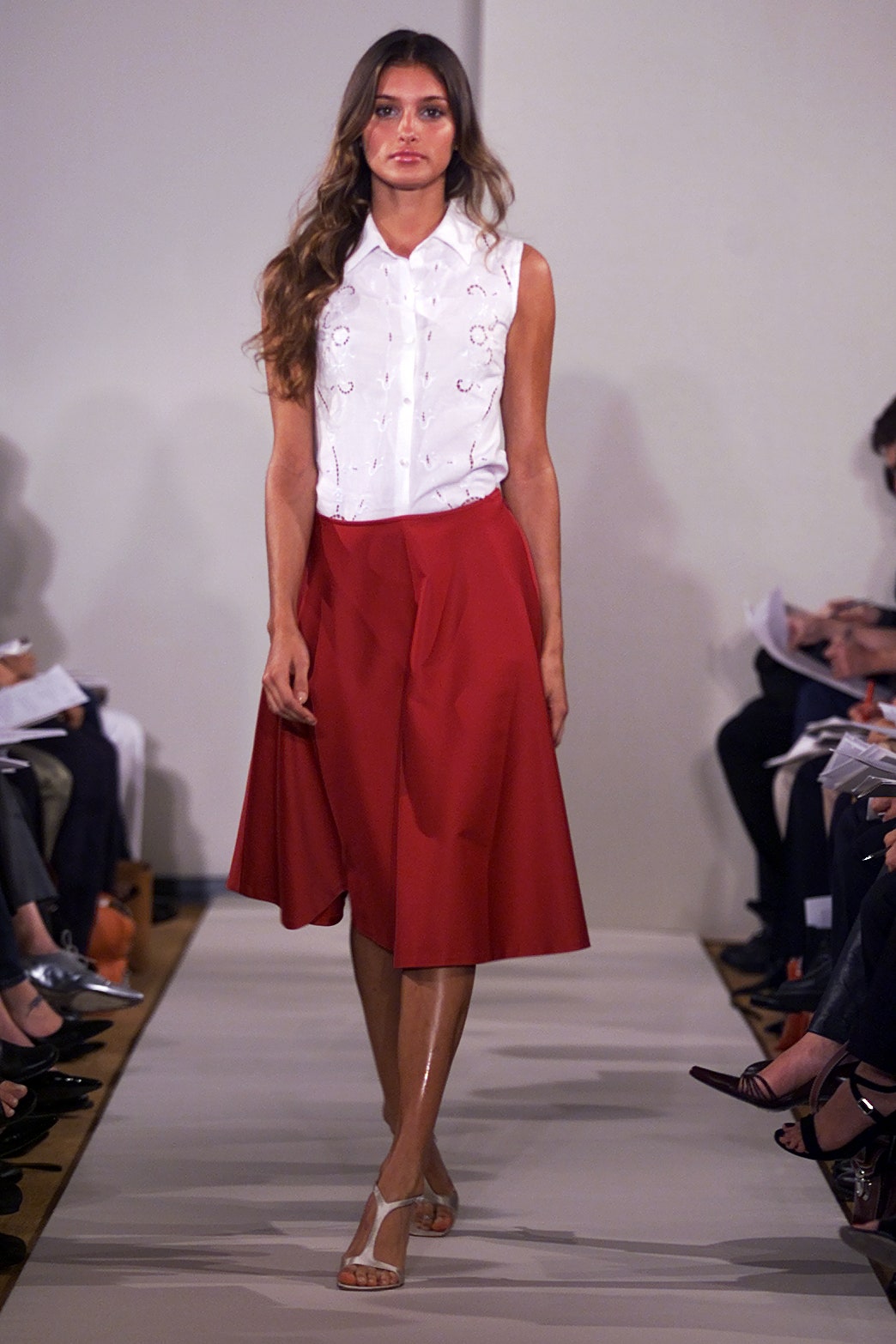 white embroidered blouse and red skirt