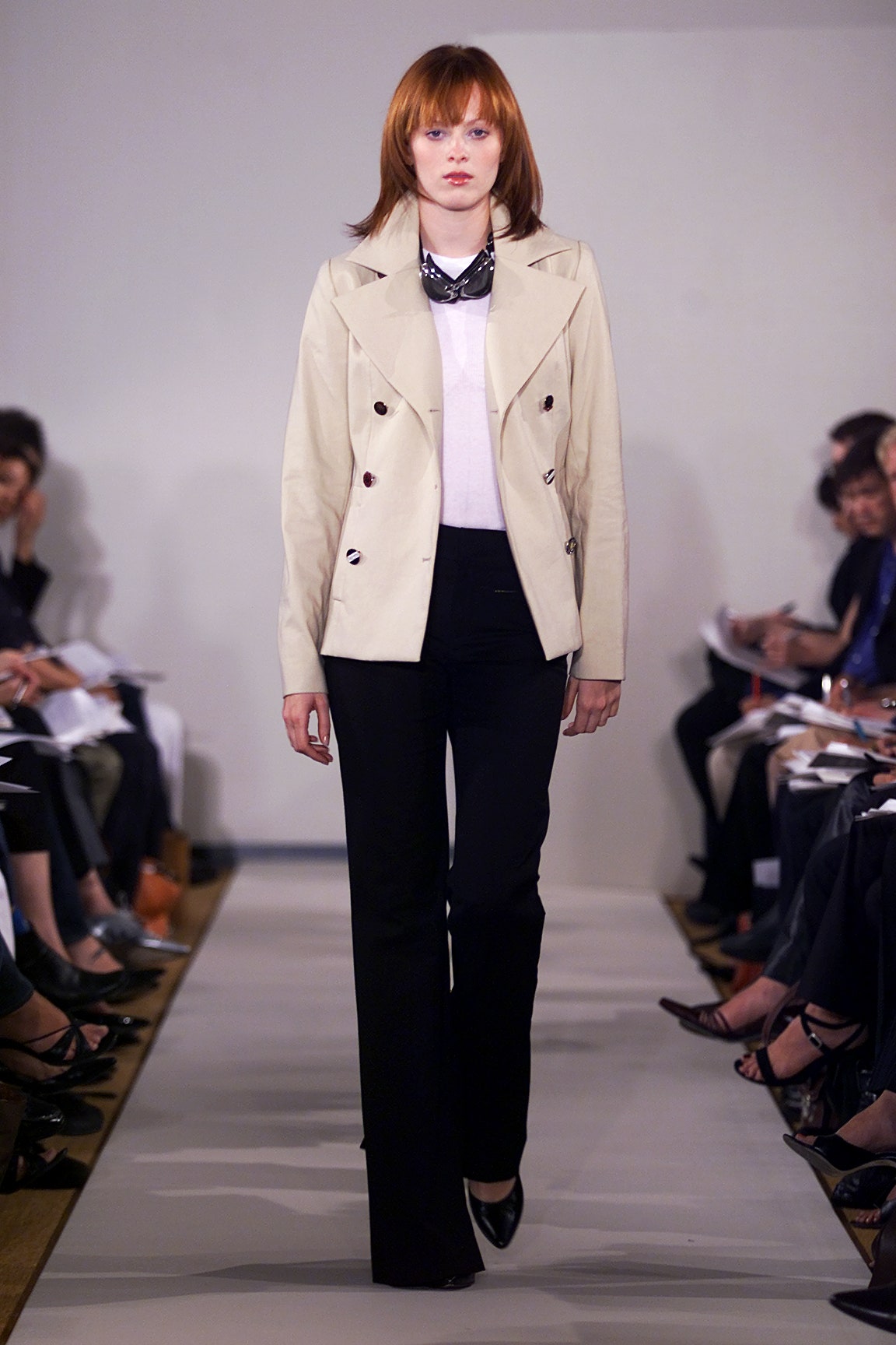 beige tailored blazer with black pants
