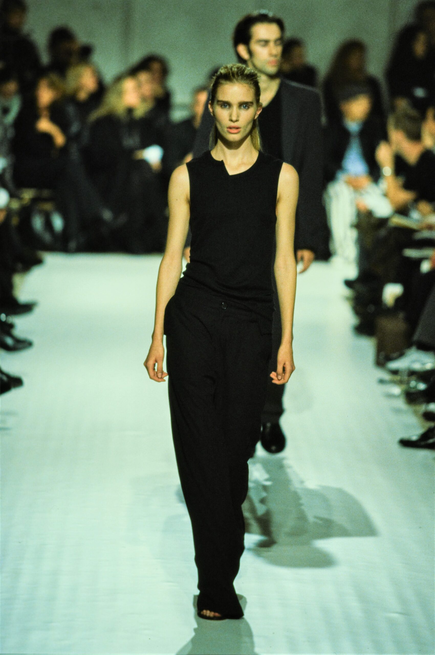 black fitted sleeveless top and relaxed pants