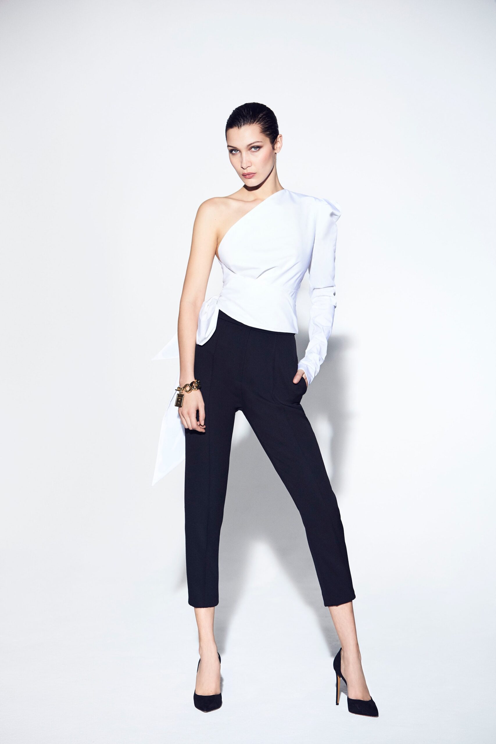 white asymmetric top with black tailored pants