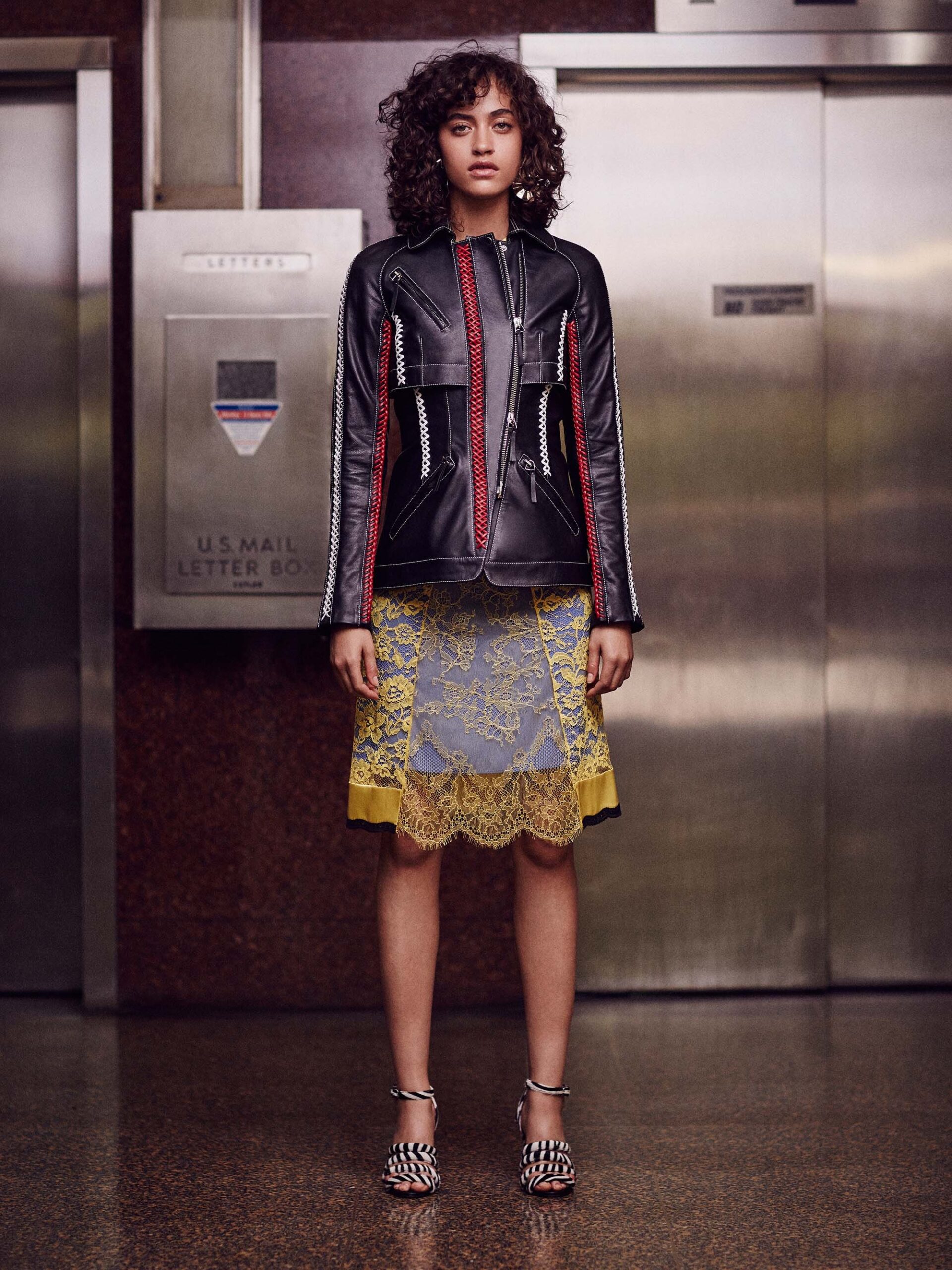 black leather fitted jacket and gray lace mini skirt