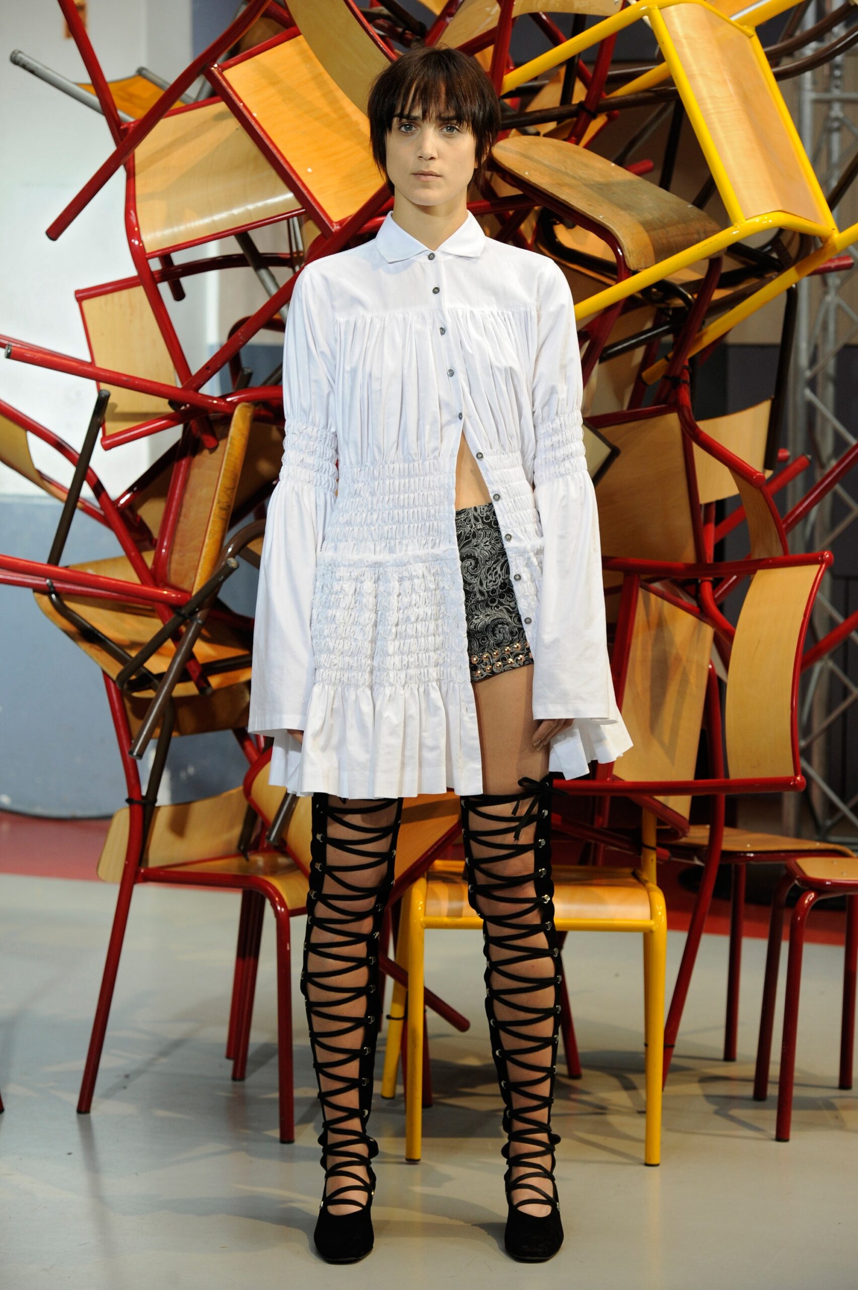 white shirt-dress with black shorts