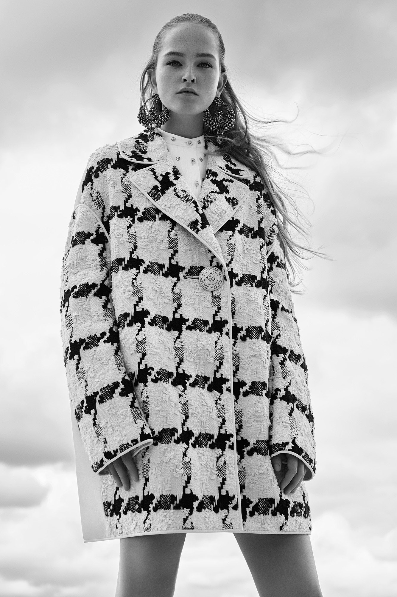 oversized black and white coat with fitted dress
