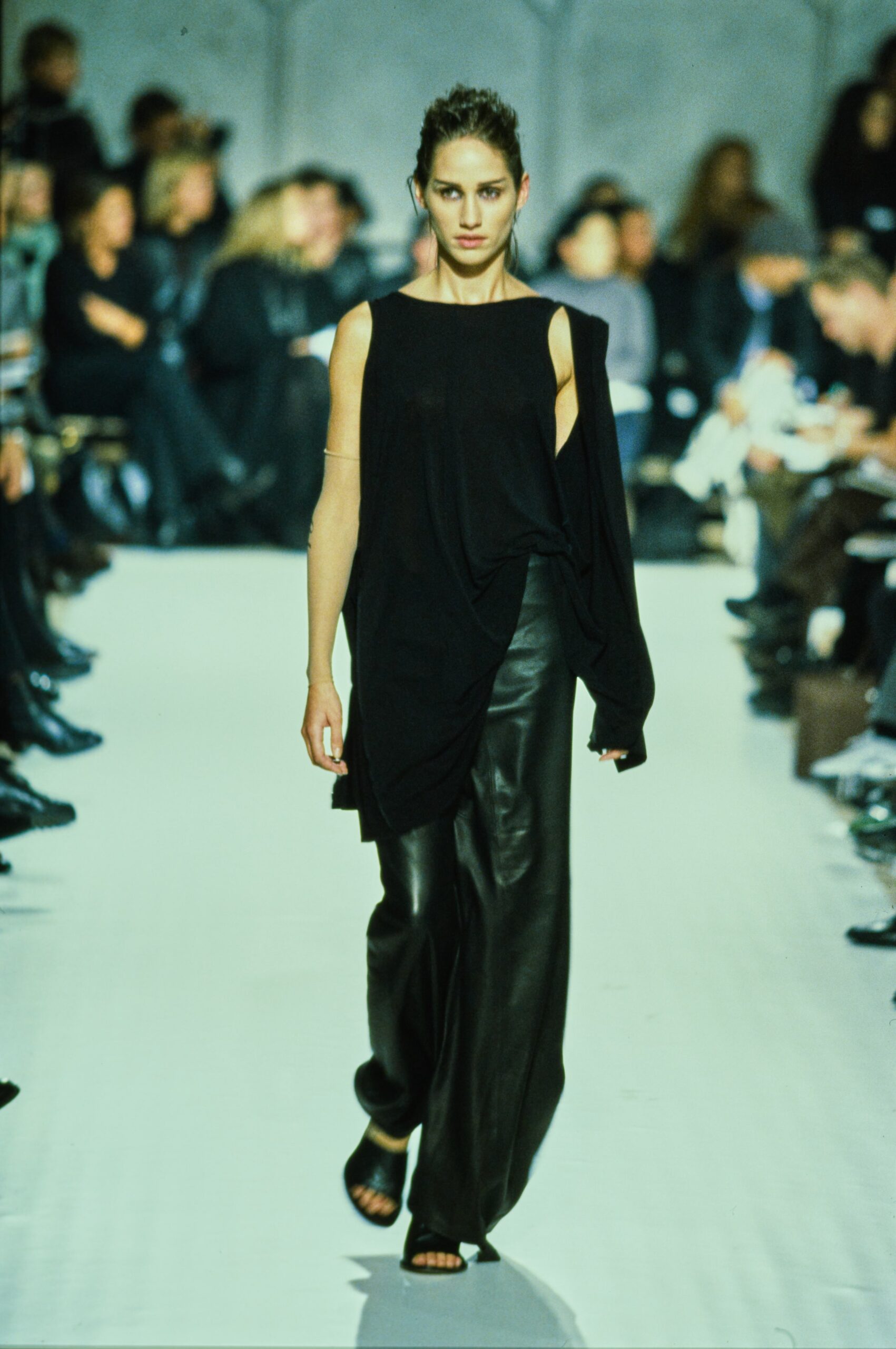 black relaxed top and leather pants