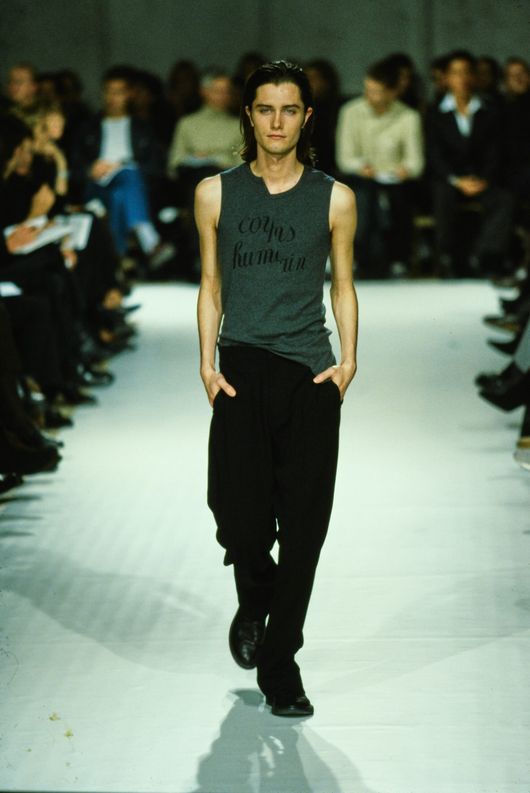 gray tank-top and black pants