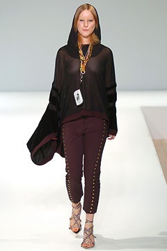 black silk poncho with maroon pants