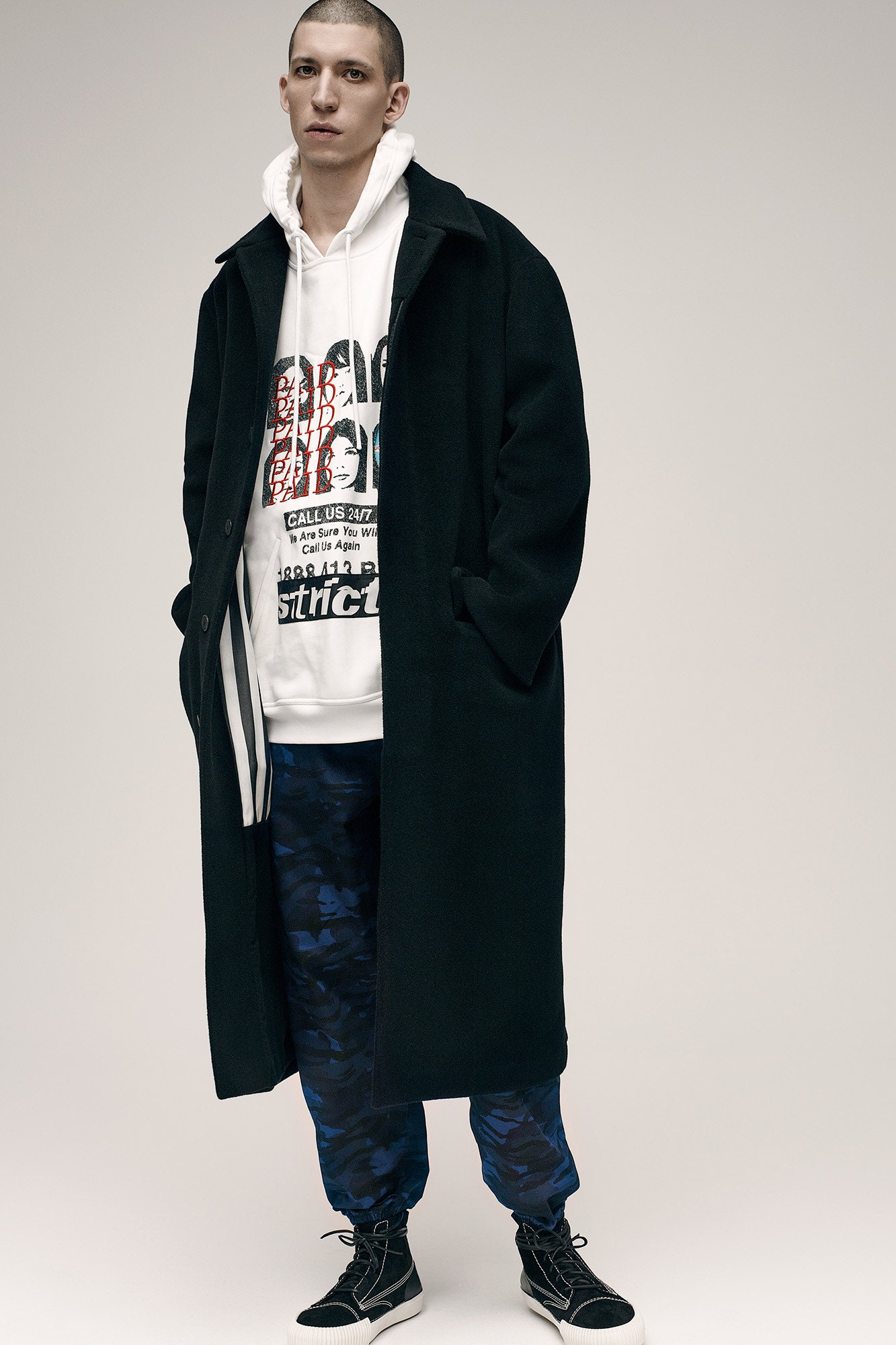 black wool coat with white hoodie