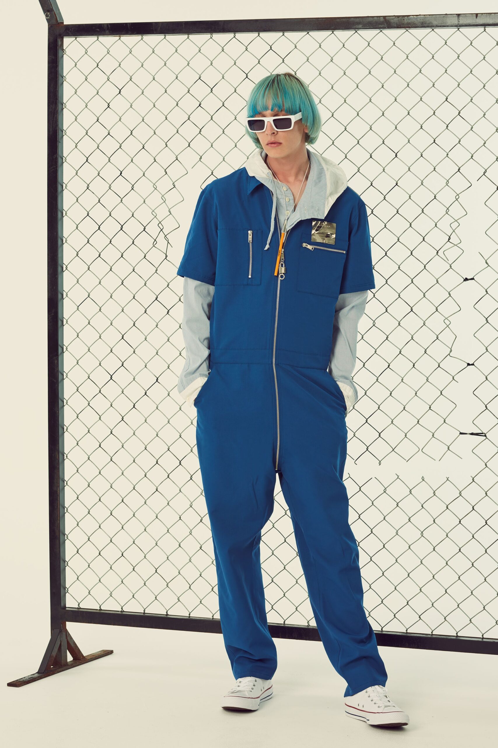 blue relaxed jumpsuit with gray hoodie