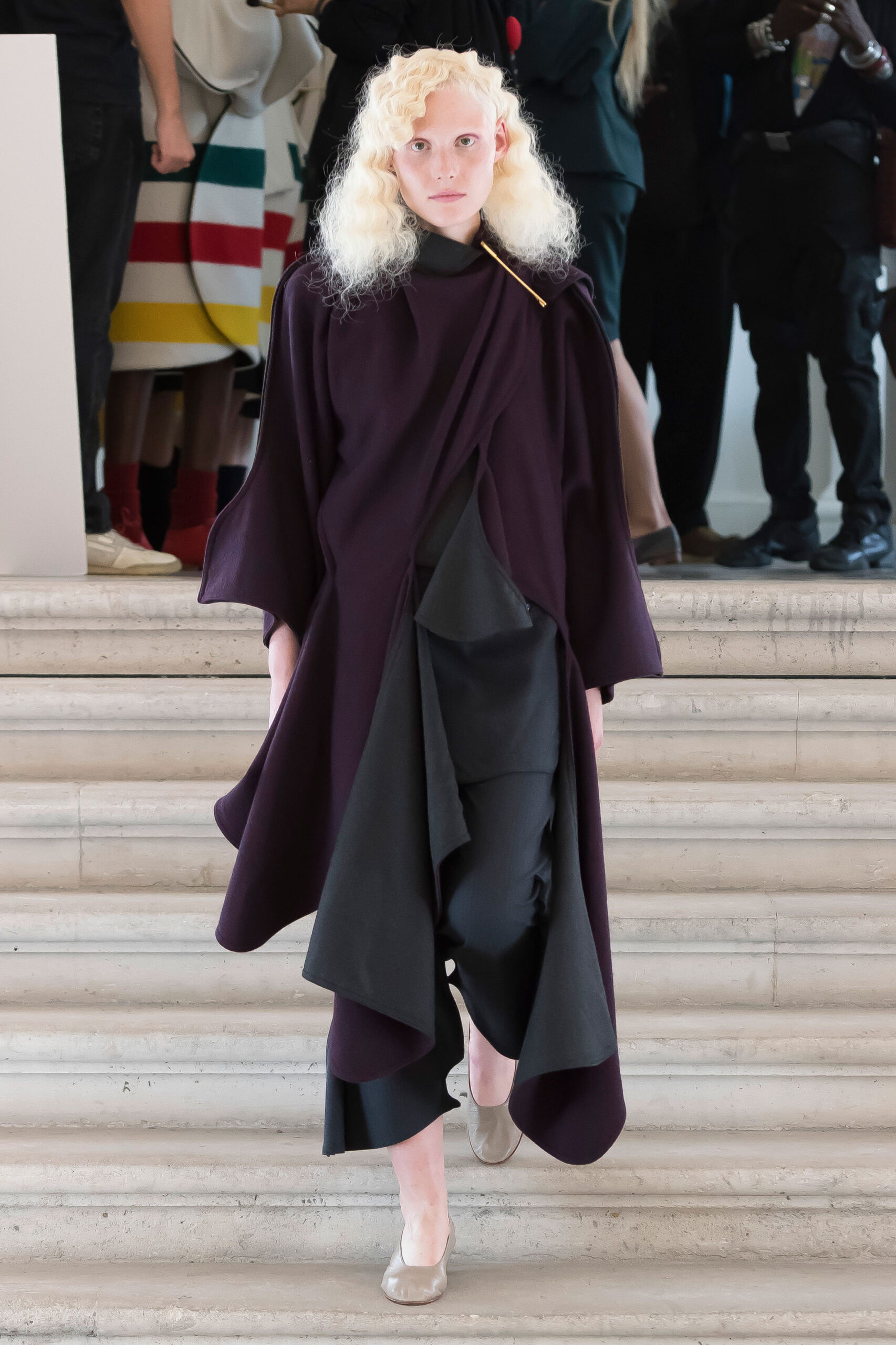 purple wool cape with black pants