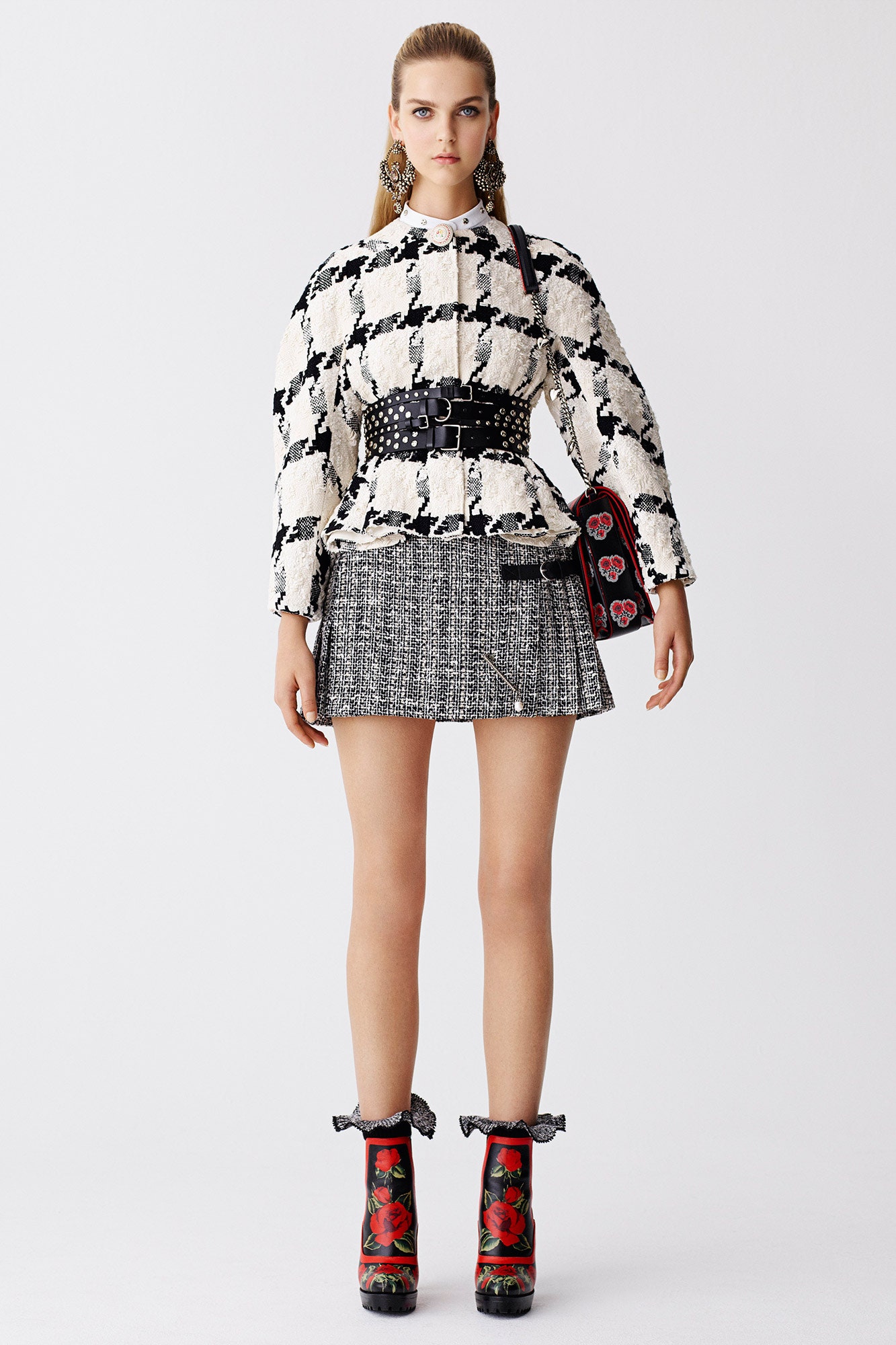 fitted black and white blouse with pleated skirt