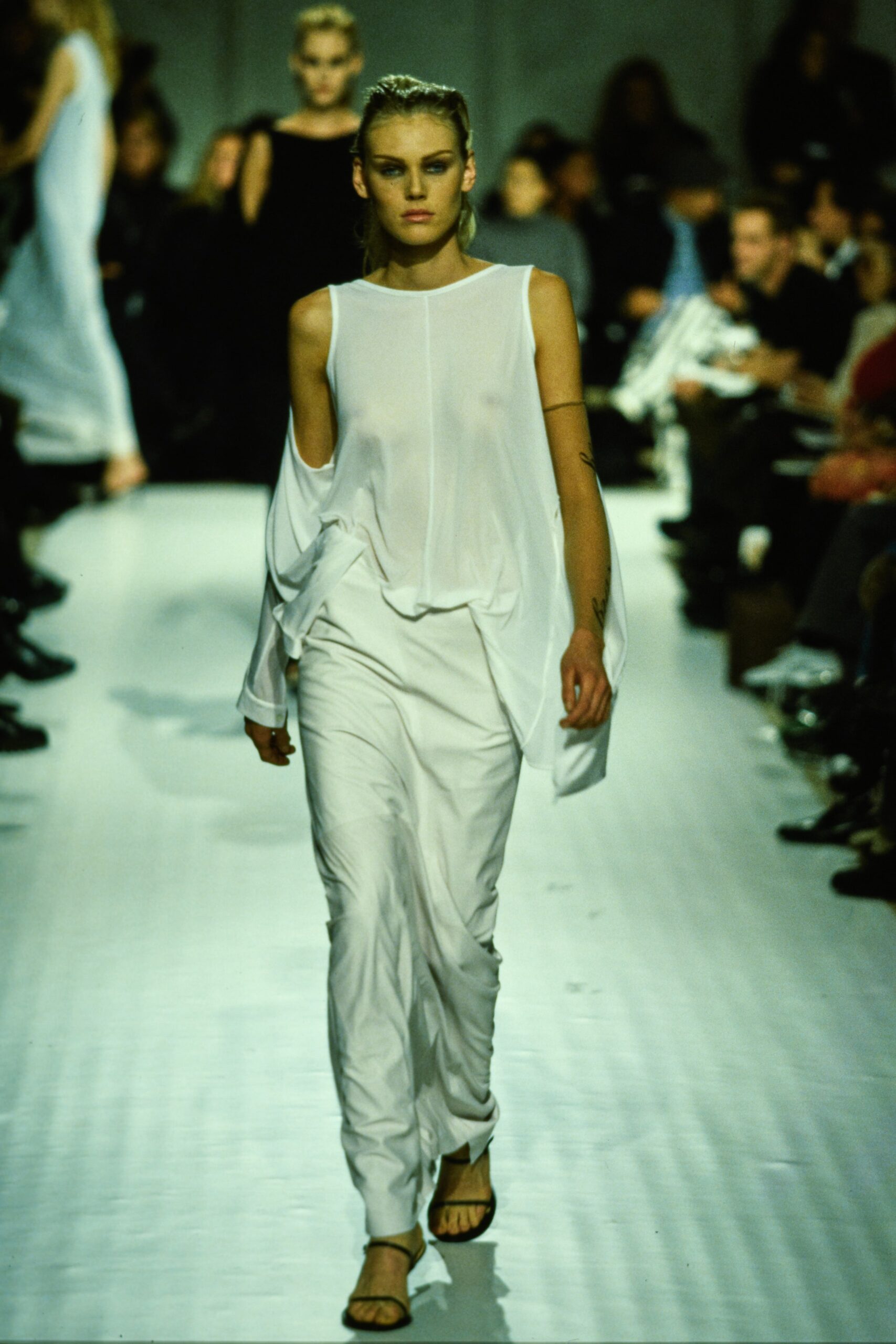 white silk relaxed top with fitted pants