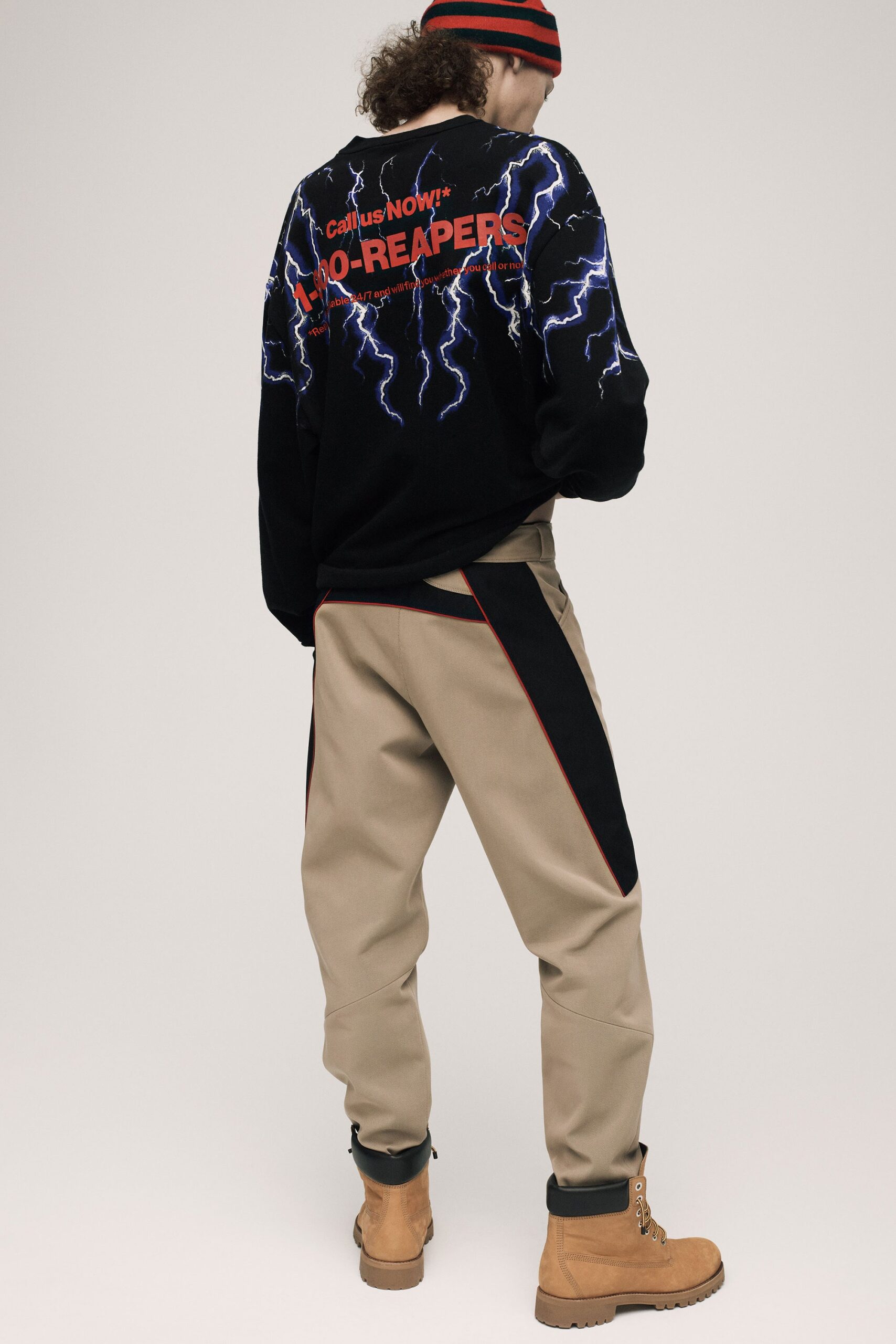 black relaxed sweater beige cargo pants