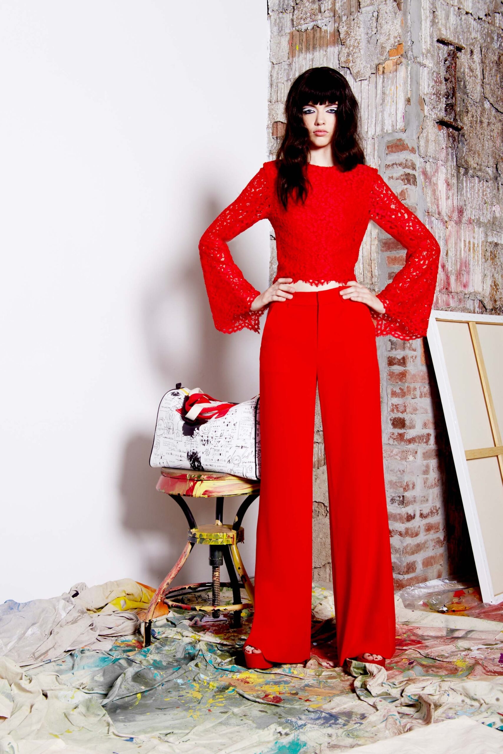 red lace top and tailored pants