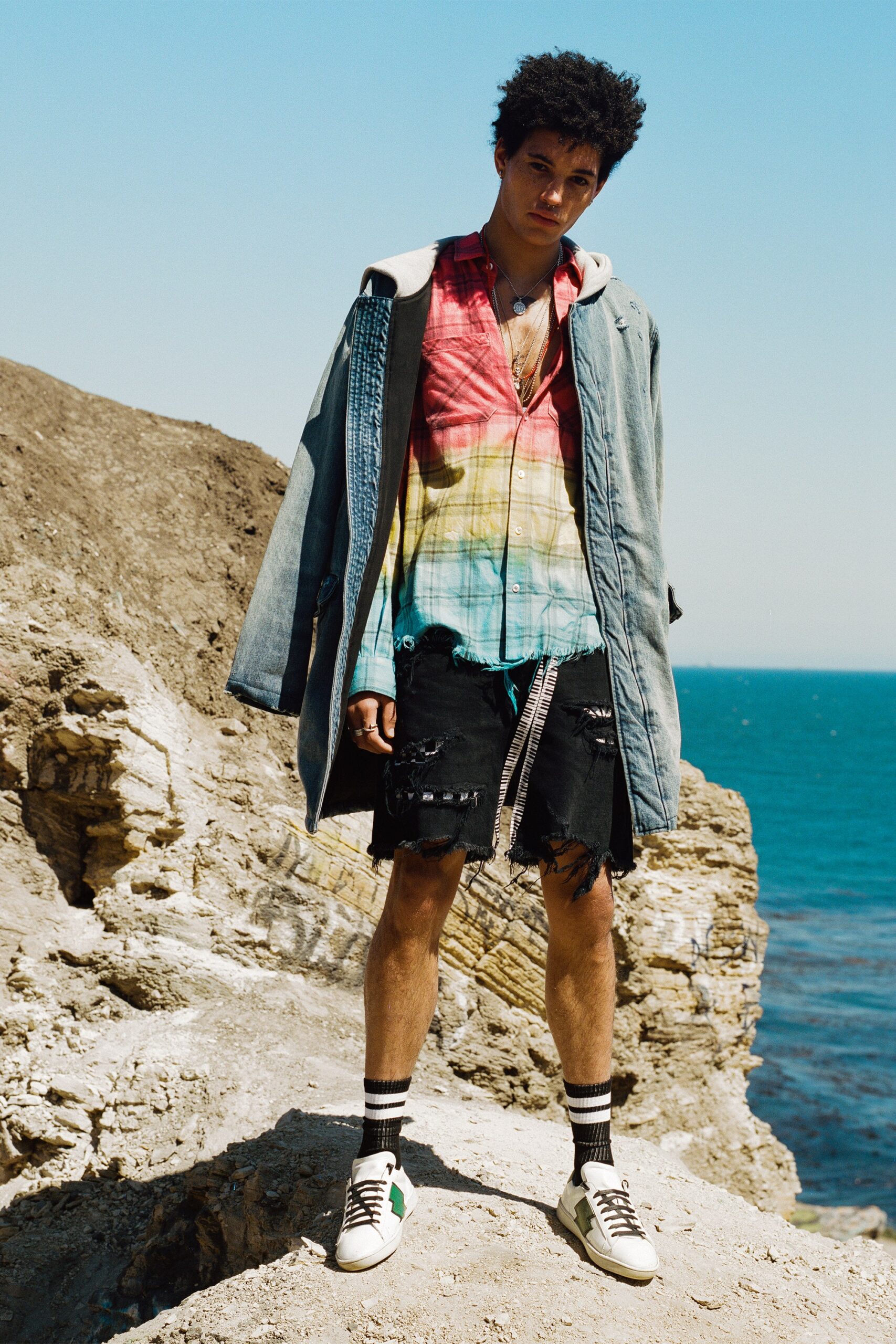 blue denim coat with multi-colored shirt