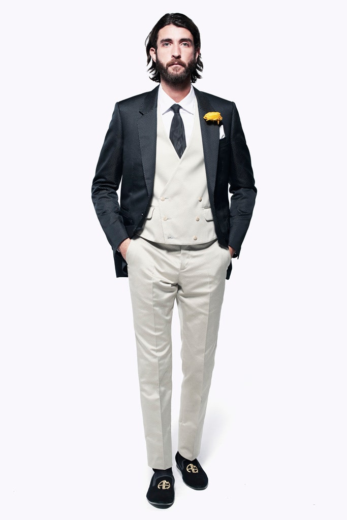 black tailored suit with beige vest