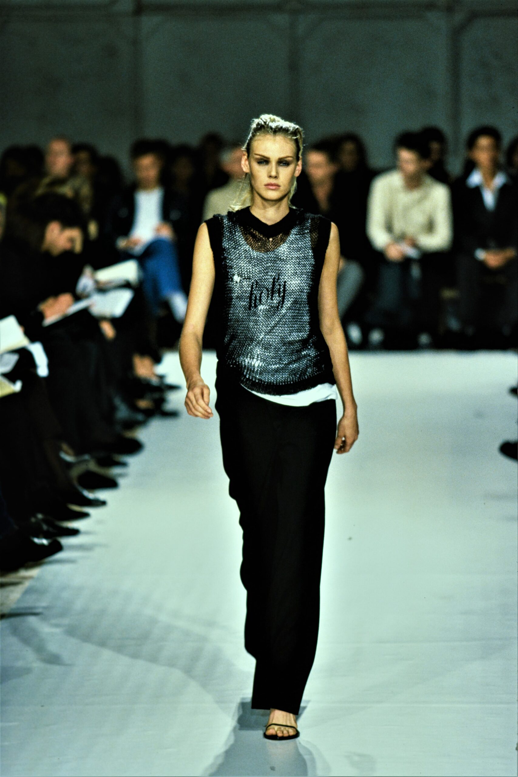 black sequined sleeveless top with tailored pants