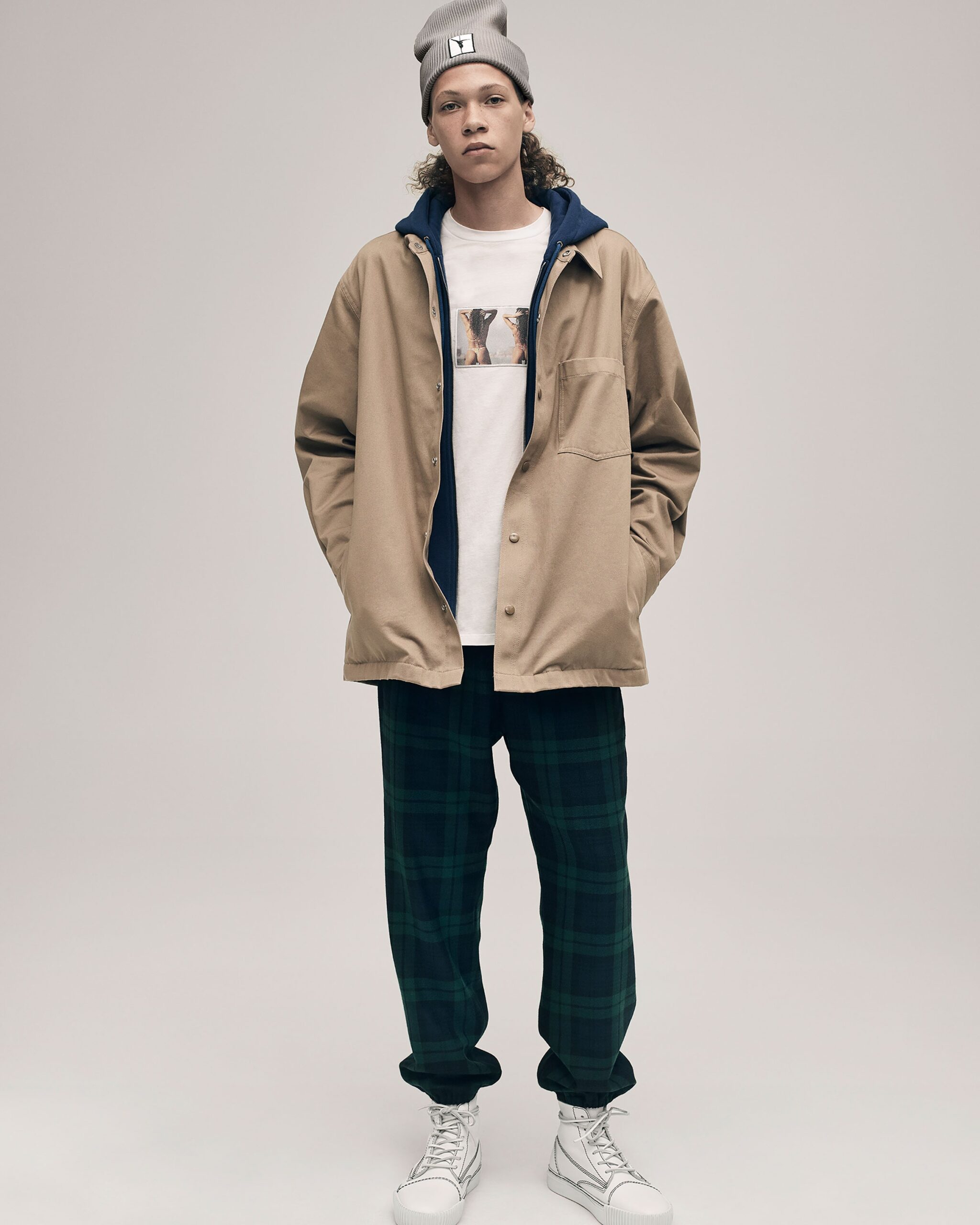 beige relaxed jacket with t-shirt and checked pants