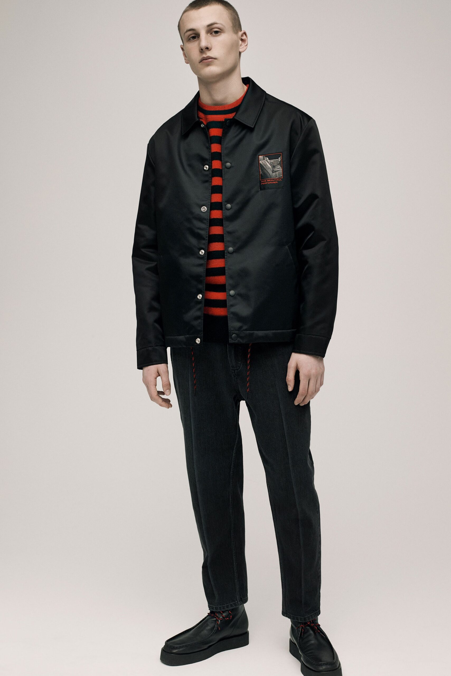 black jacket with striped shirt