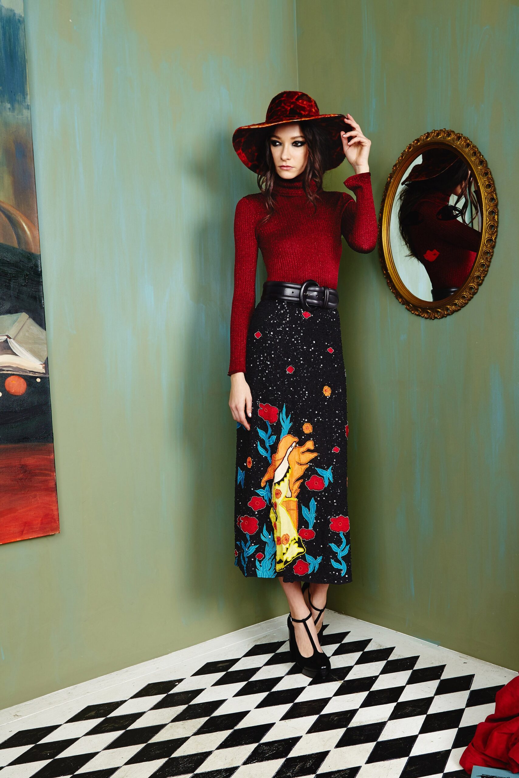 red fitted top with black skirt