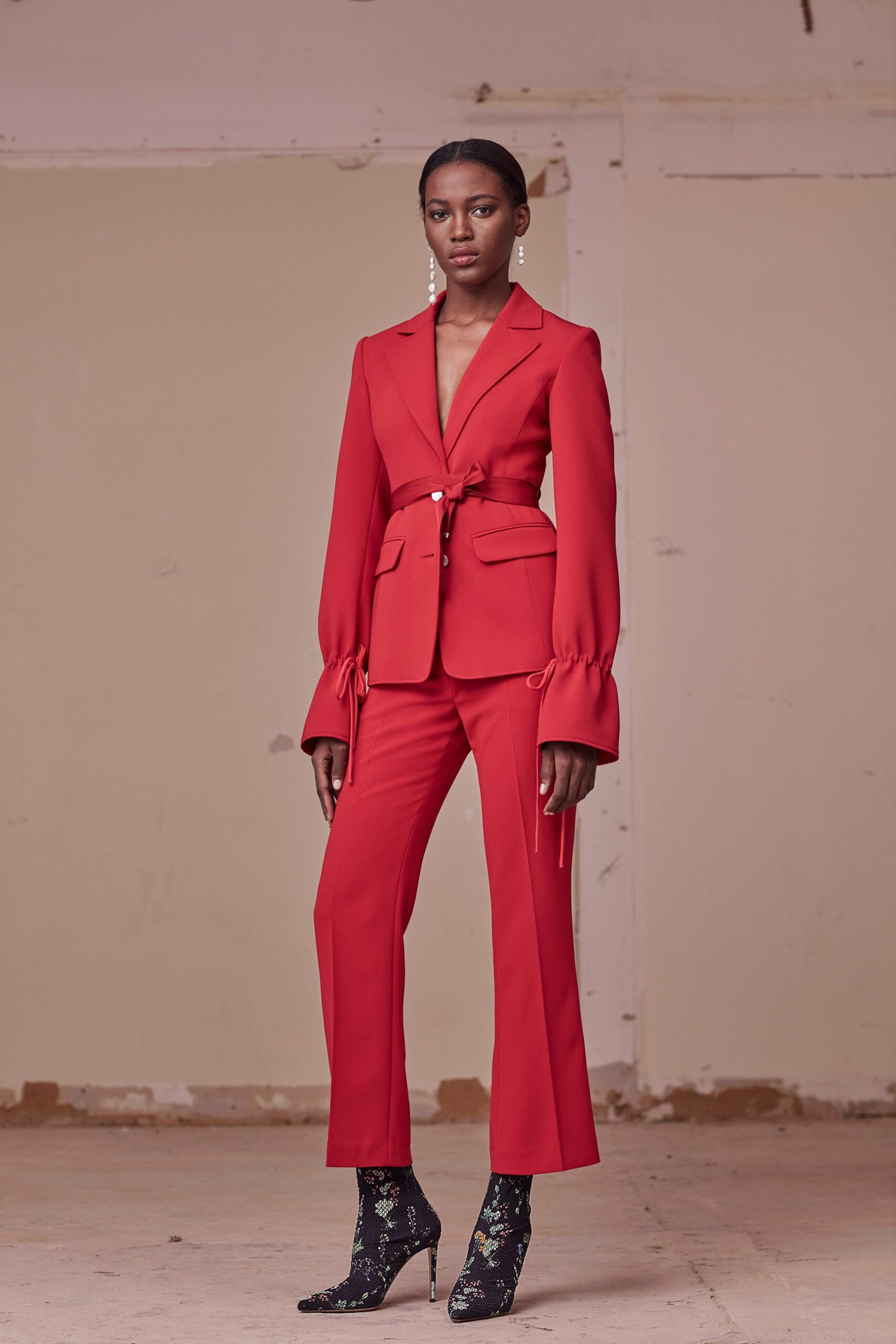 red long-sleeve collared tailored buttoned belted blazer