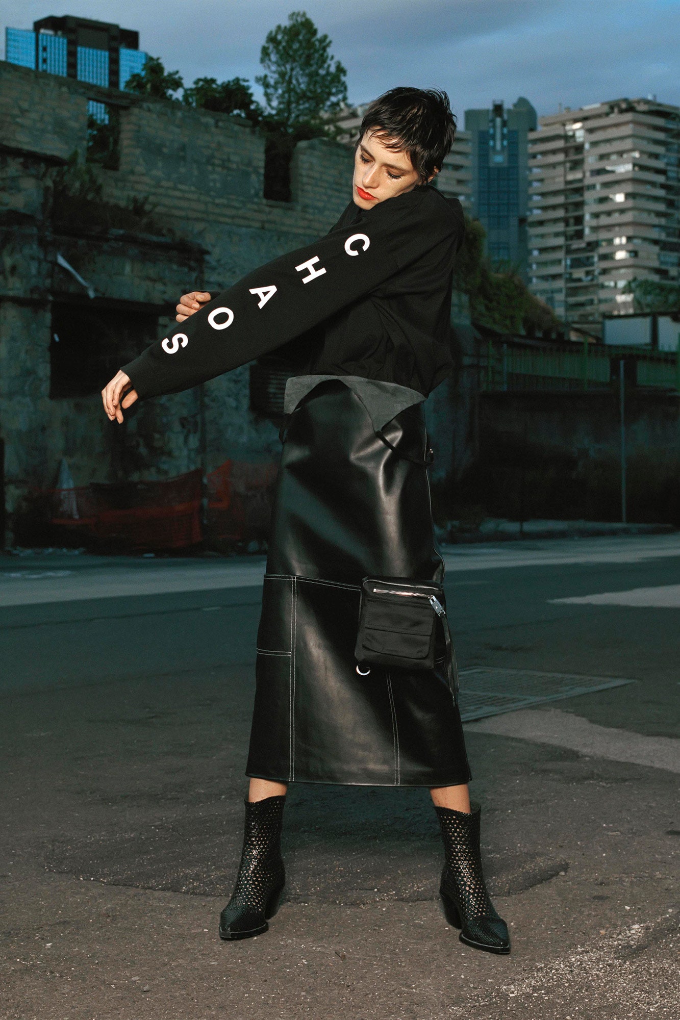 black fitted top and leather skirt