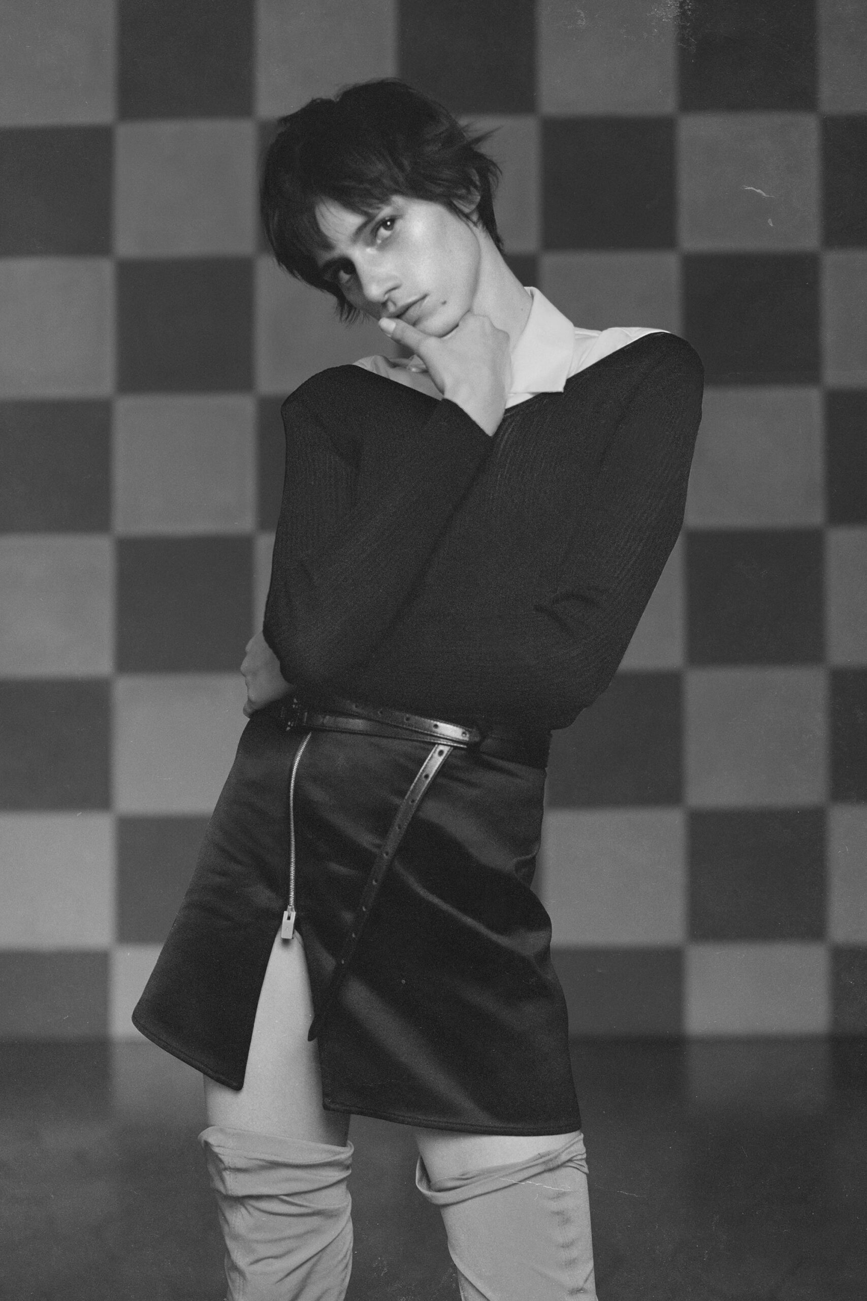 black fitted top and mini skirt