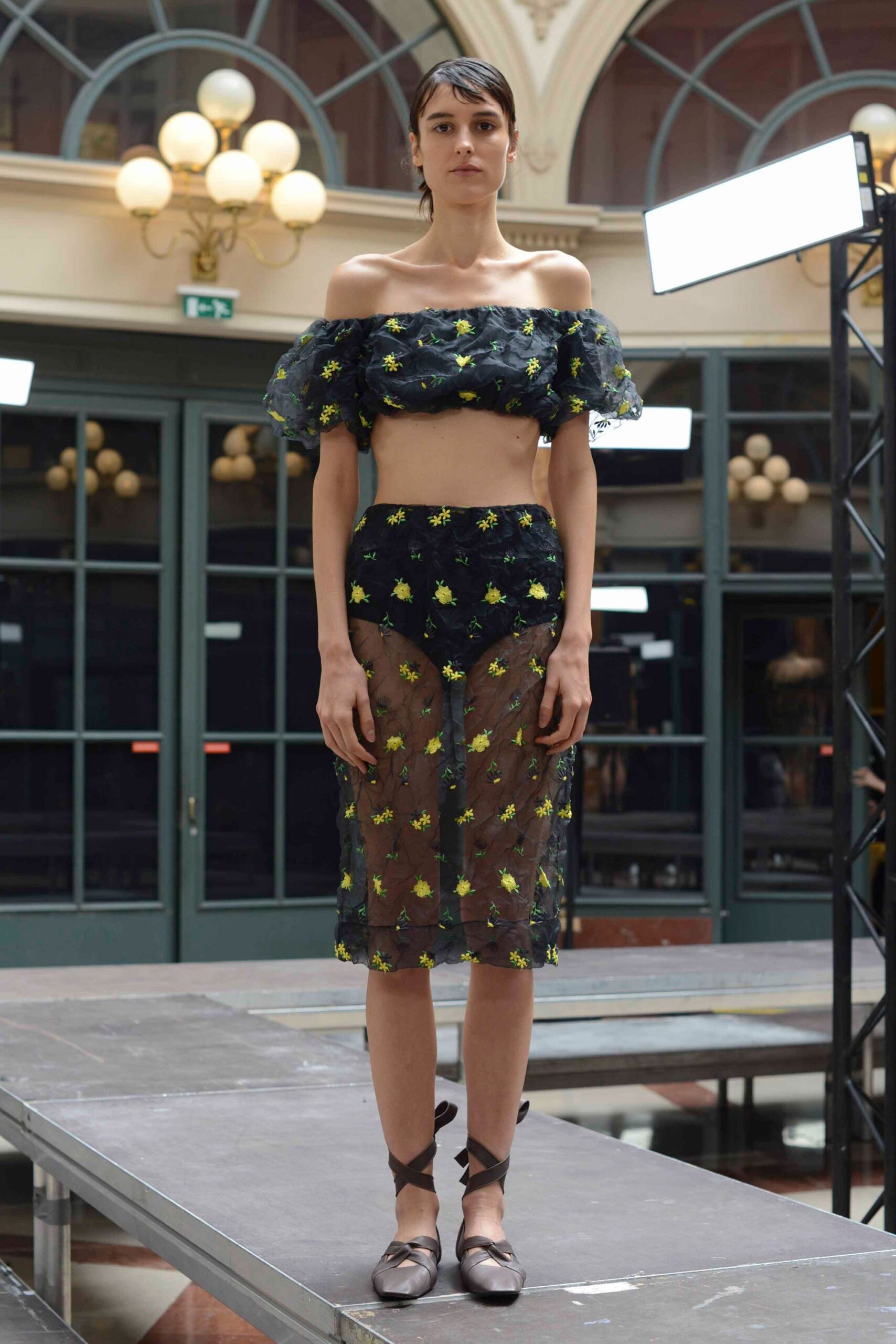 black chiffon off-shoulder sleeveless fitted ruffled sheer top