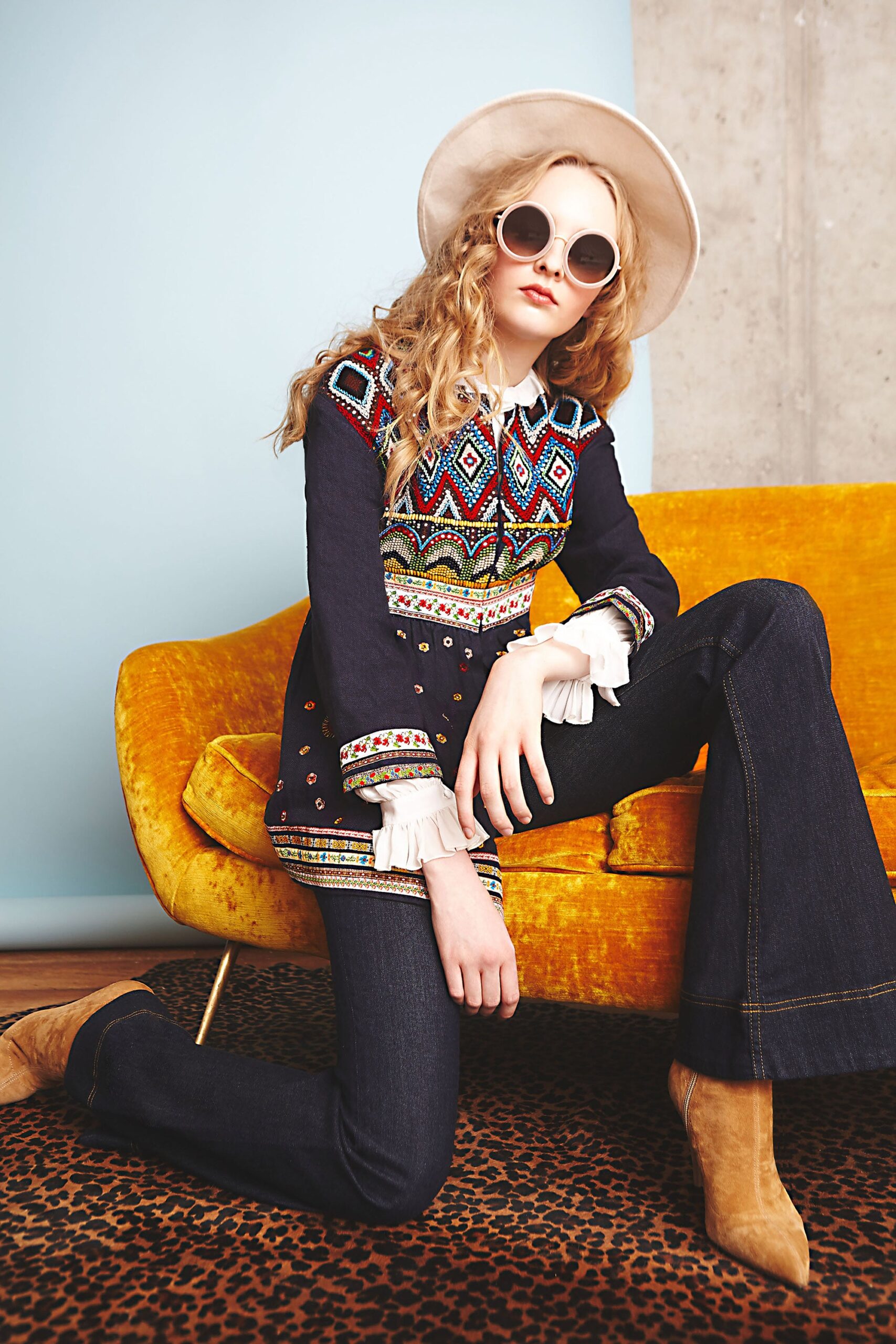 embroidered black top with flared jeans