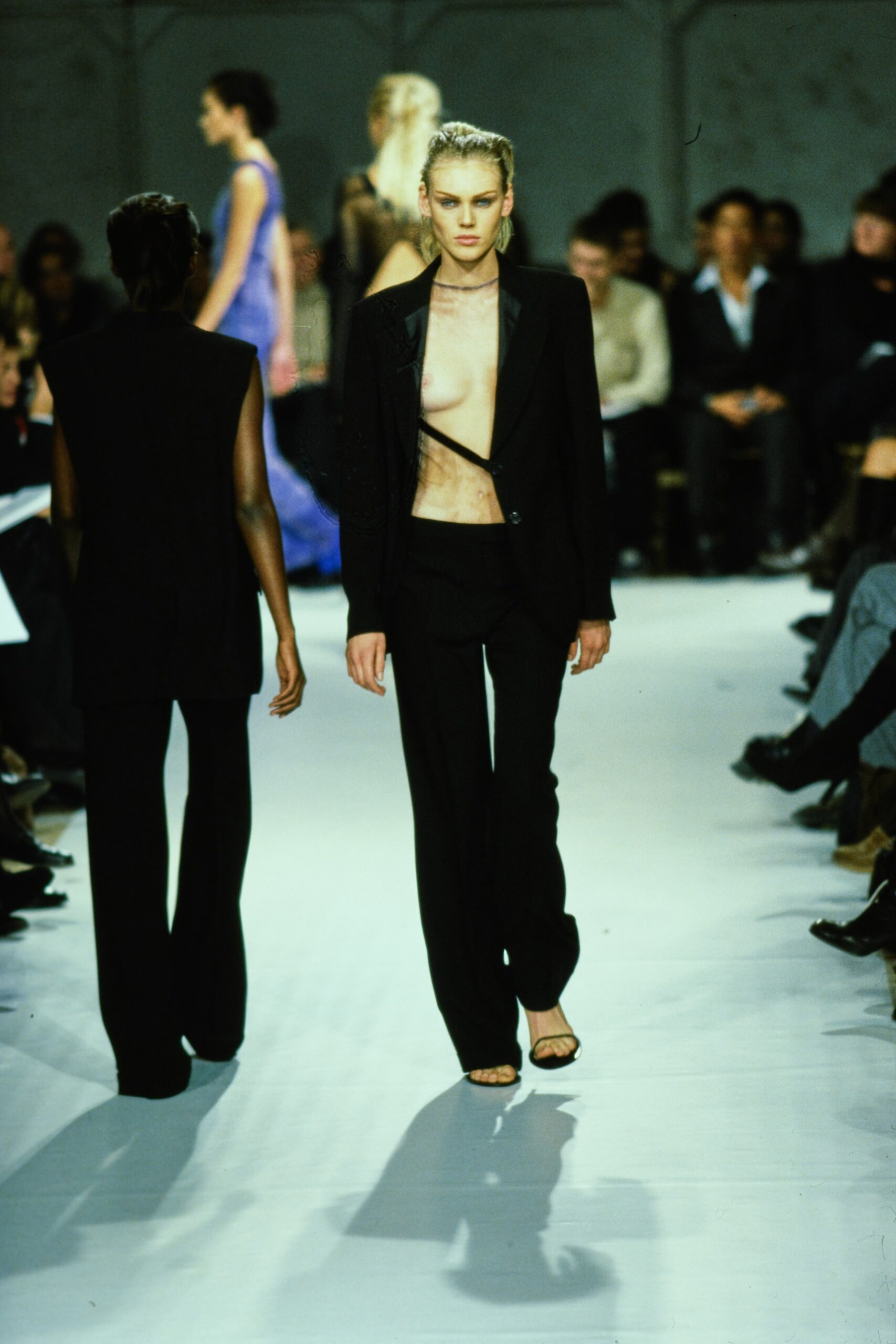 black tailored suit with strappy shoes