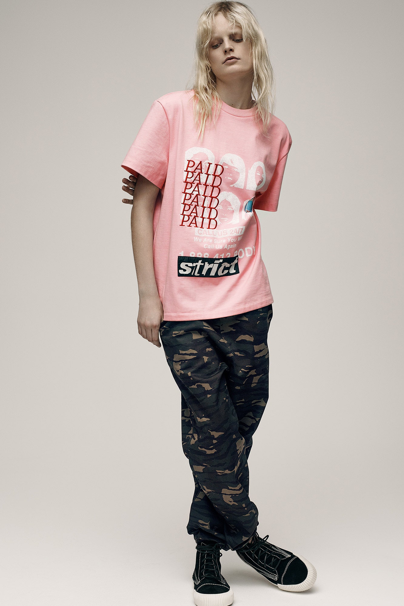 pink printed t-shirt and camouflage pants