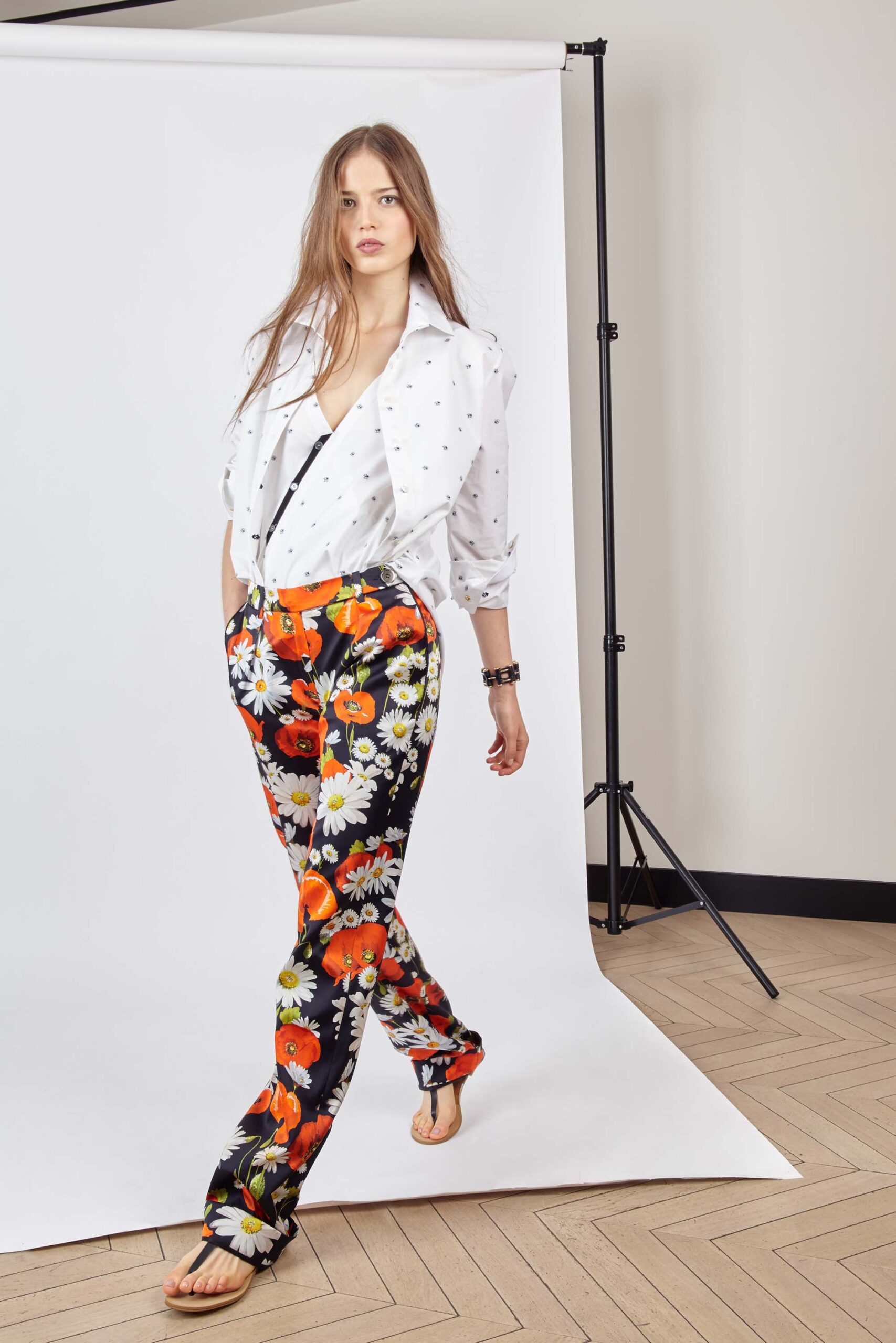 white relaxed shirt with floral pants