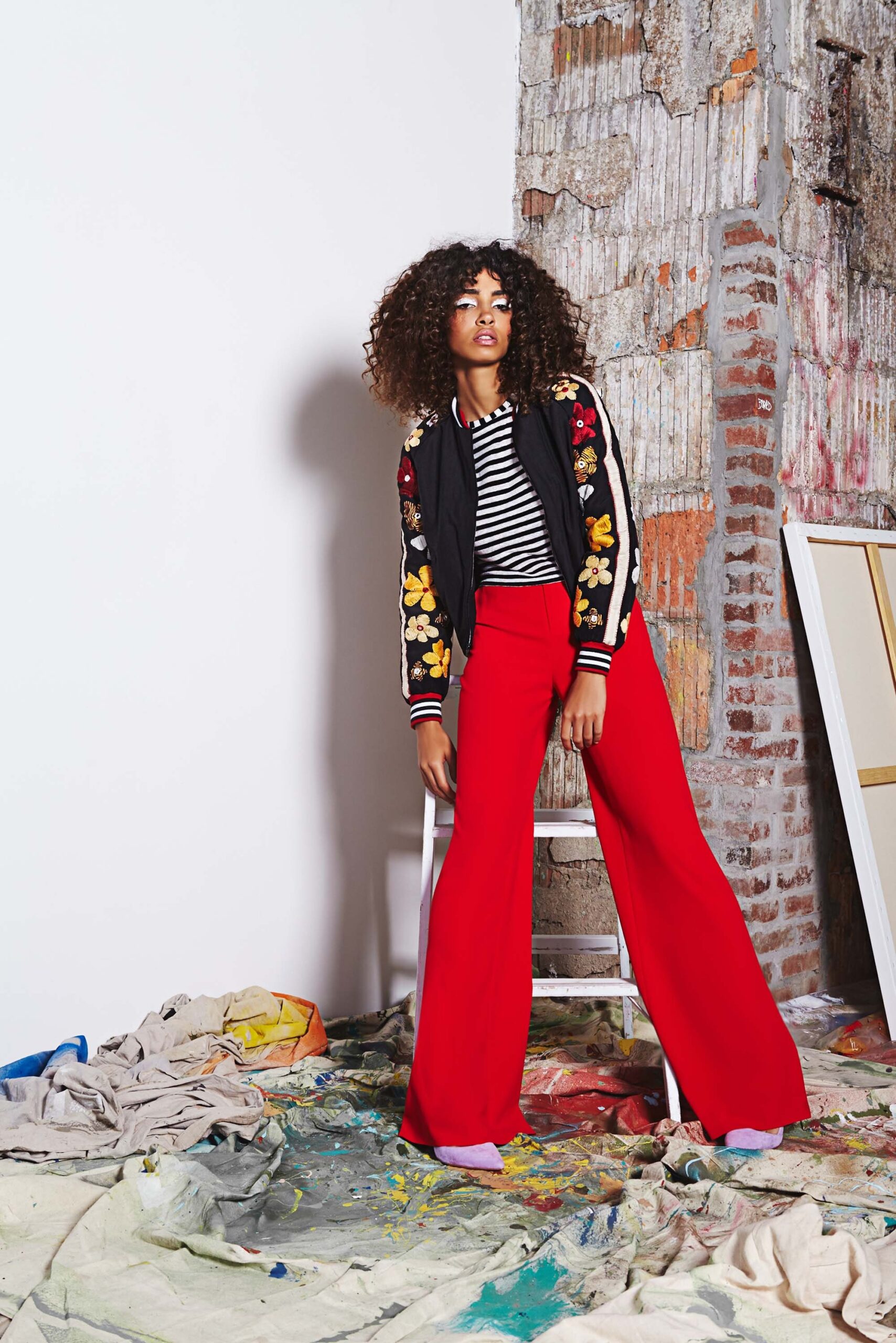 black embroidered jacket with red pants