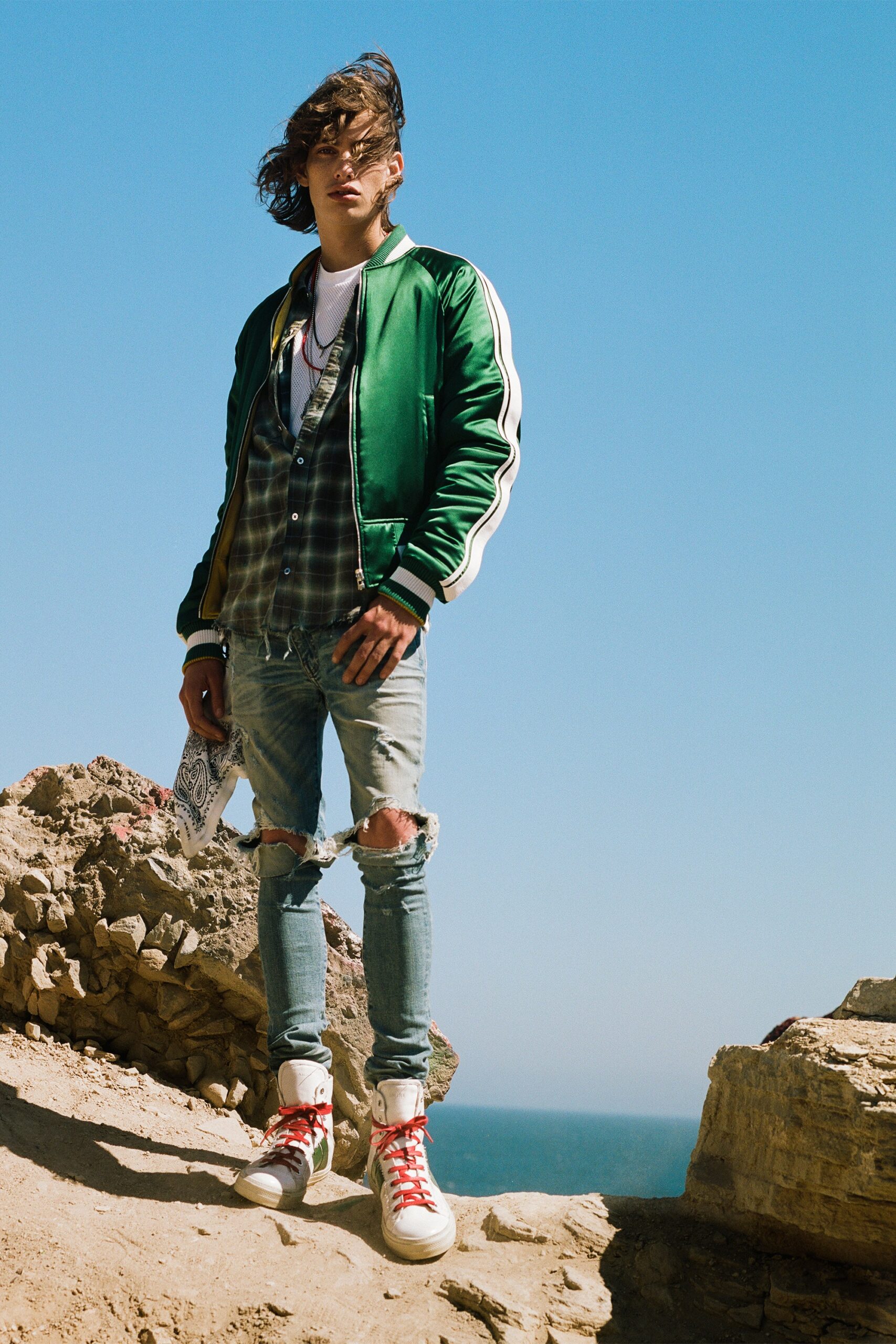 green satin jacket with distressed jeans